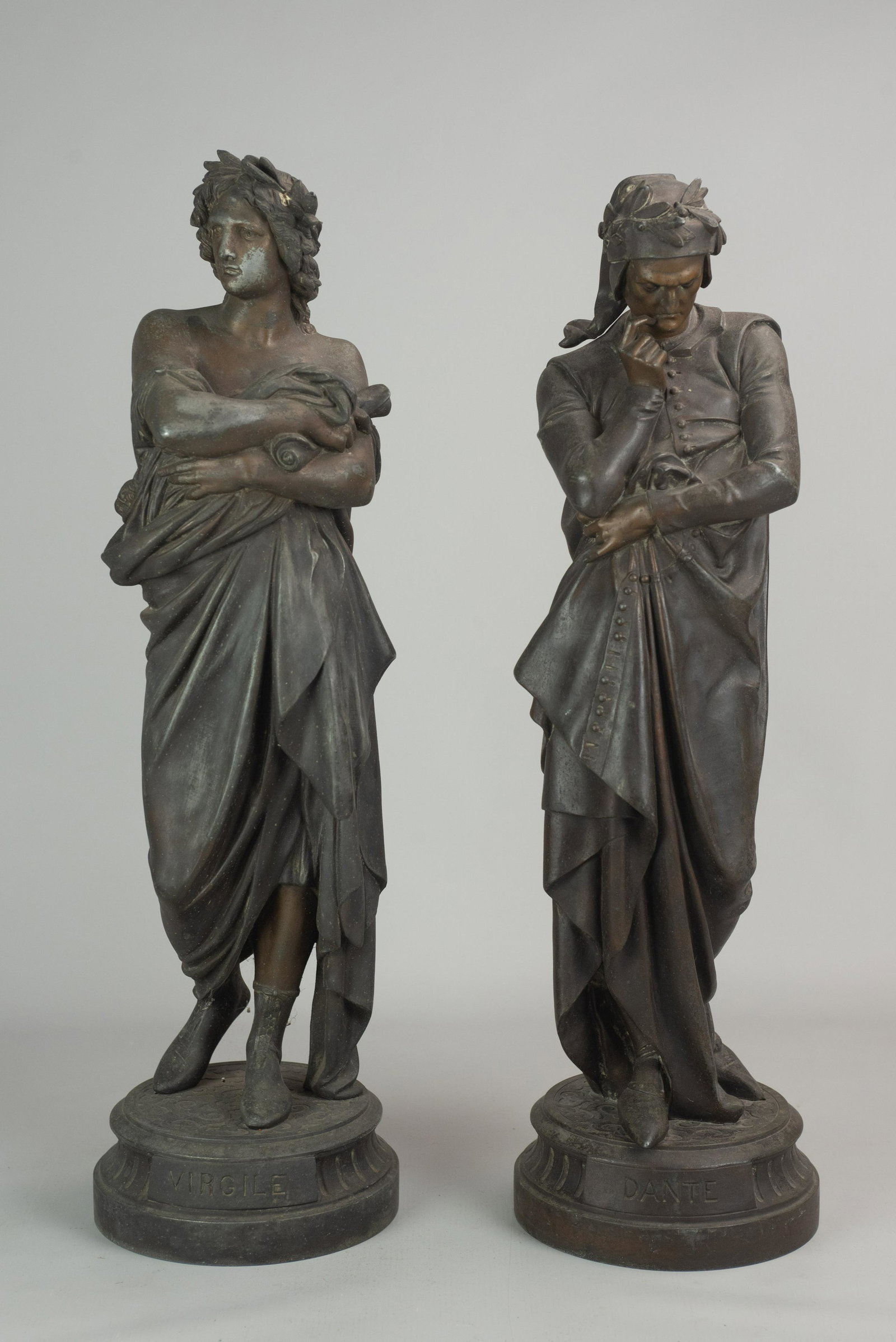 Virgile and Dante Spelter Figures: Bronze patinated spelter figures of Virgile and Dante, both items on joined platform with name plaque at center bottom, Virgile signed A. Carrier at back, 23' h each, slight rubbing on Virgile