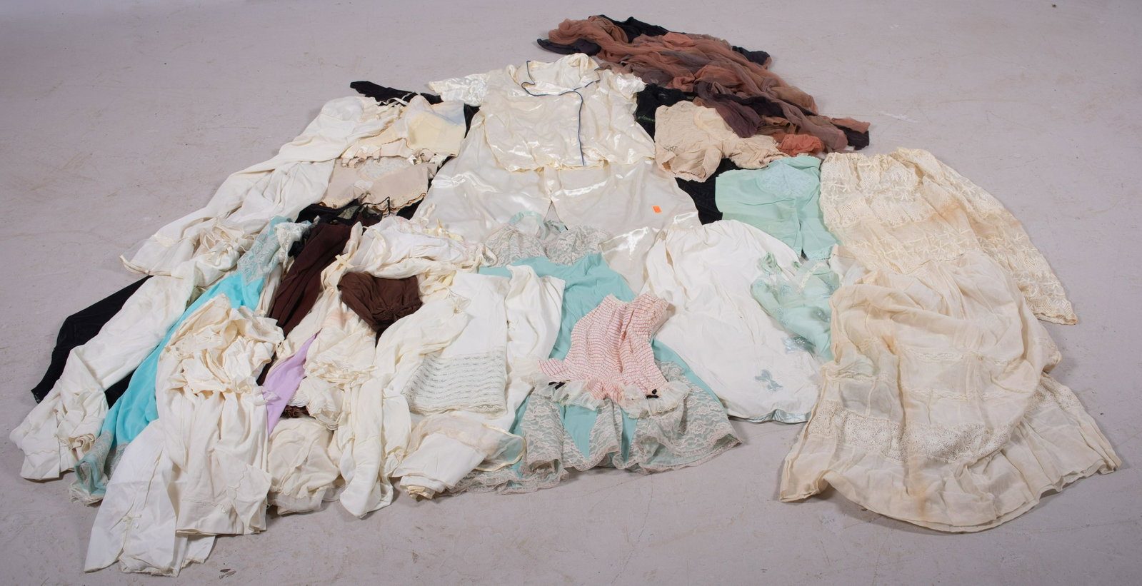 Slips, Lingerie and Stockings: Slips, lingerie and stockings c/o (15)+ assorted slips in dress and skirt form, girdles, 50's cream silk pajamas and (15)+ pairs thigh high stockings