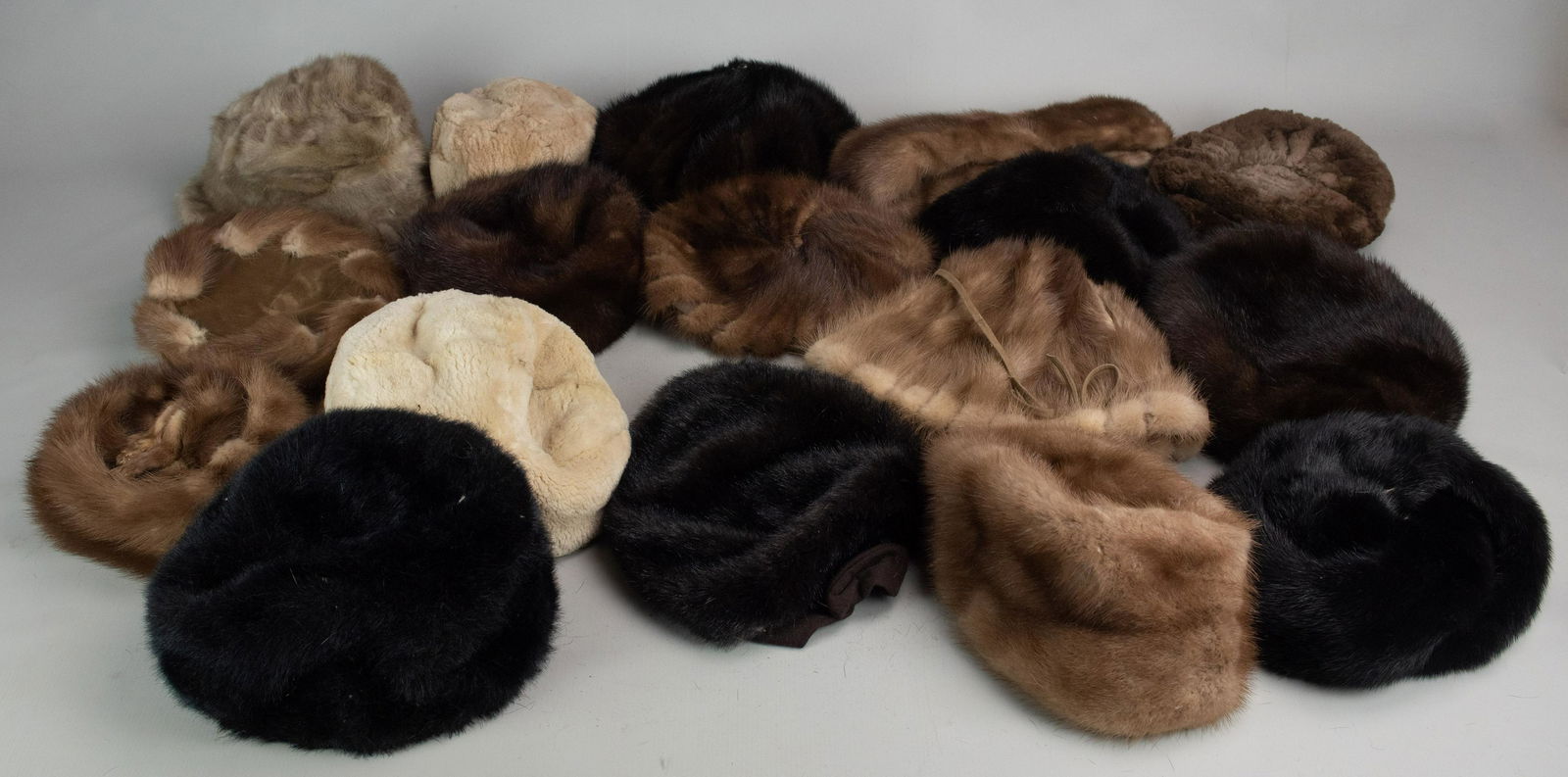 (14) 1960's Fur Hats: (14) 1960's fur hats in mink and beaver composition. Also includes (2) faux fur hats and (1) mink collar. Please note fur items can not be shipped internationally.