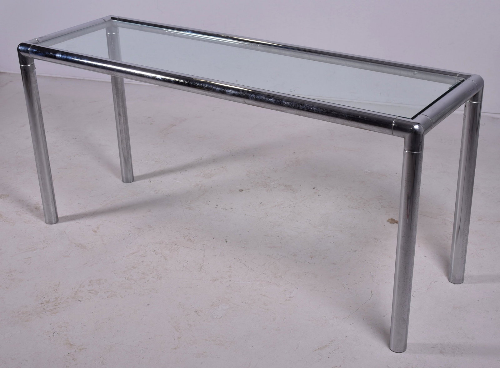 Modern Design chrome & glass sofa table: Modern Design chrome & glass sofa table, 28-1/2" h x 61" l, some chips to glass