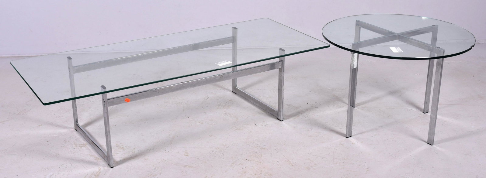 (2) pc Modern Design table set: (2) pc Modern Design table set, c/o coffee table, side table, flat bar chrome with glass tops, coffee table 16" h x 60" w, both with chips in glass