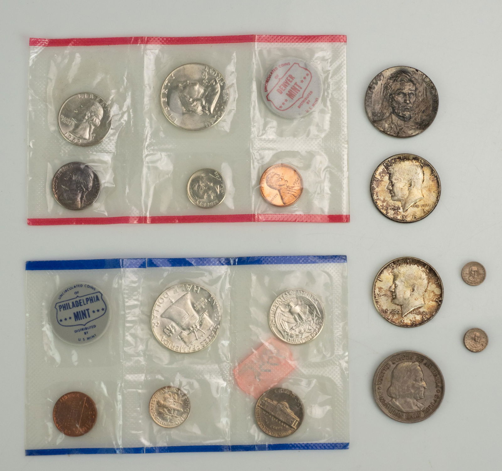 US Mint Sets, Silver Coins, Medallions: (2) 1962-D, P US Mint Sets, (2) 1964 Kennedy halves, 1893 Columbian Exposition half dollar, 1909 Abraham Lincoln Medallic Art Co medallion, 2 Presidential mini-medallions, John Adams, William McKinley