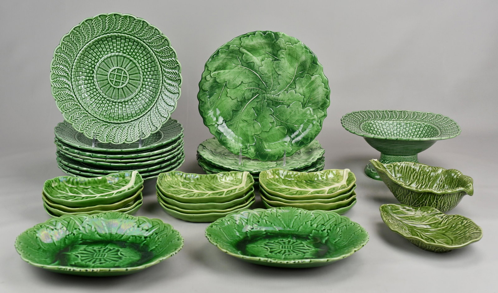 (29) Pcs Cabbage Form Dinnerware: (29) Pcs cabbage form dinnerware including (8) Bordallo Pinheiro green basketweave leaf edge low bowls, 10-1/2" and matching compote, 4-1/2" h, (4) leaf decorated Vietri Italy plates, 10-3/4", (2) Wed