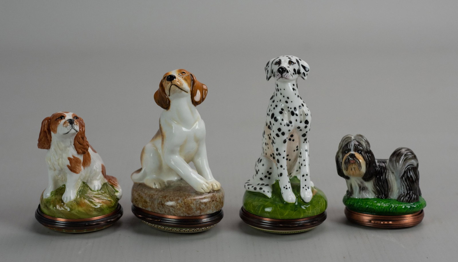 (4) Halcyon Days Figural Dog Trinket Boxes: (4) Halcyon Days figural dog trinket boxes c/o Beagle, Dalmatian, Shih Tzu and Cavalier King Charles Spaniel.