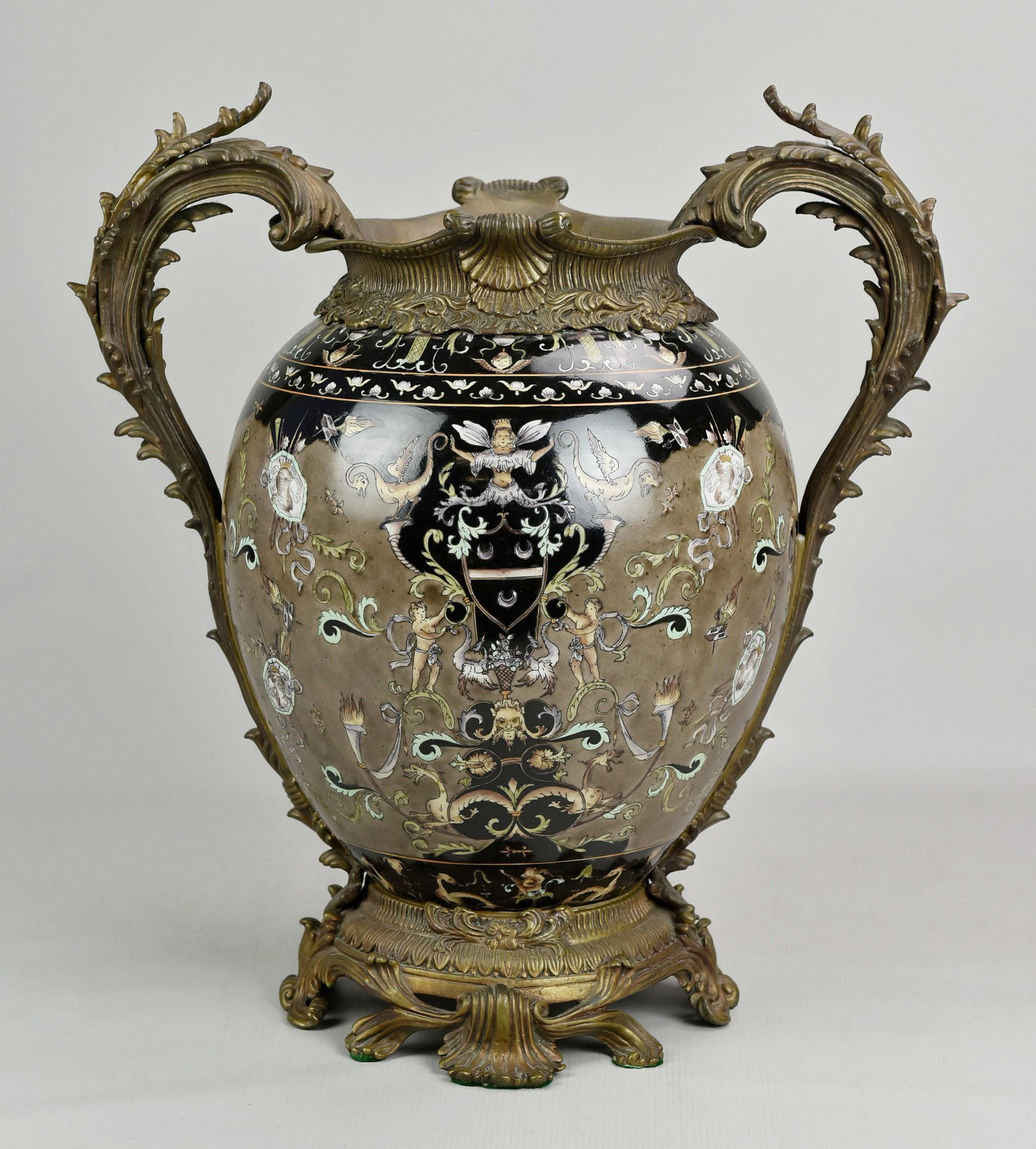 Castilian Bronze Mounted Porcelain Urn: Castillian bronze mounted porcelain urn vase, double foliage handles, classical decoration, 18-1/4" h