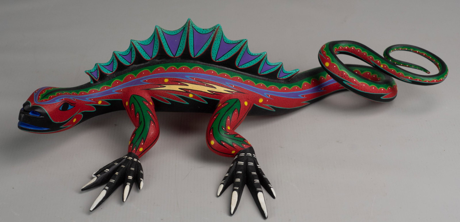 Mario y Reyna Castellanos Gonzales Folk Art Lizard: Mario y Reyna Castellanos Gonzales folk art lizard, hand carved single piece construction in multicolor decoration, 17", signed underside