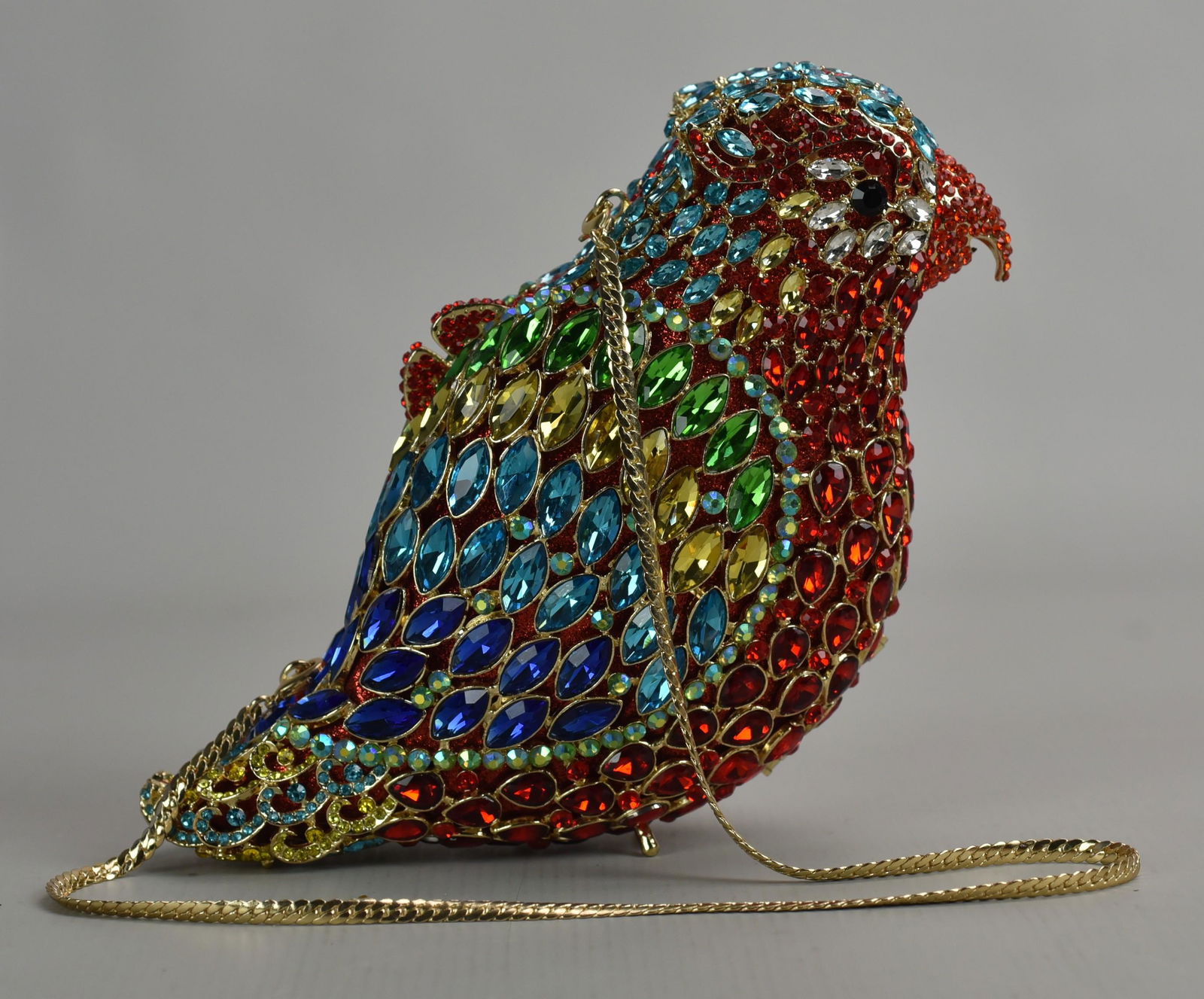 Off Park Collection Gem Parrot Clutch: Off Park Collection gem parrot clutch in Judith Leiber style. All-over rainbow gem decoration, hard body with magnet closure and gold tone chain strap, 8" L