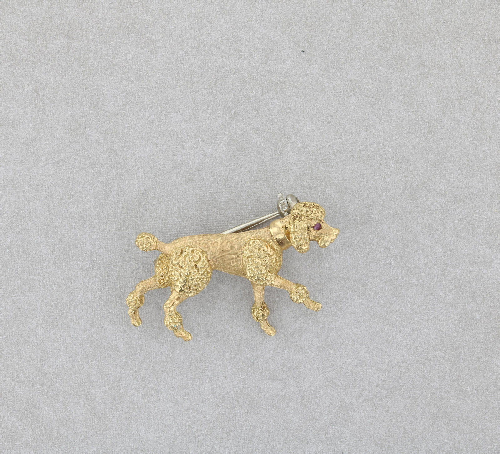 18K Yellow Gold Poodle Brooch: Singed 18K Yellow gold poodle brooch Total Weight: 4.5 Dwt.