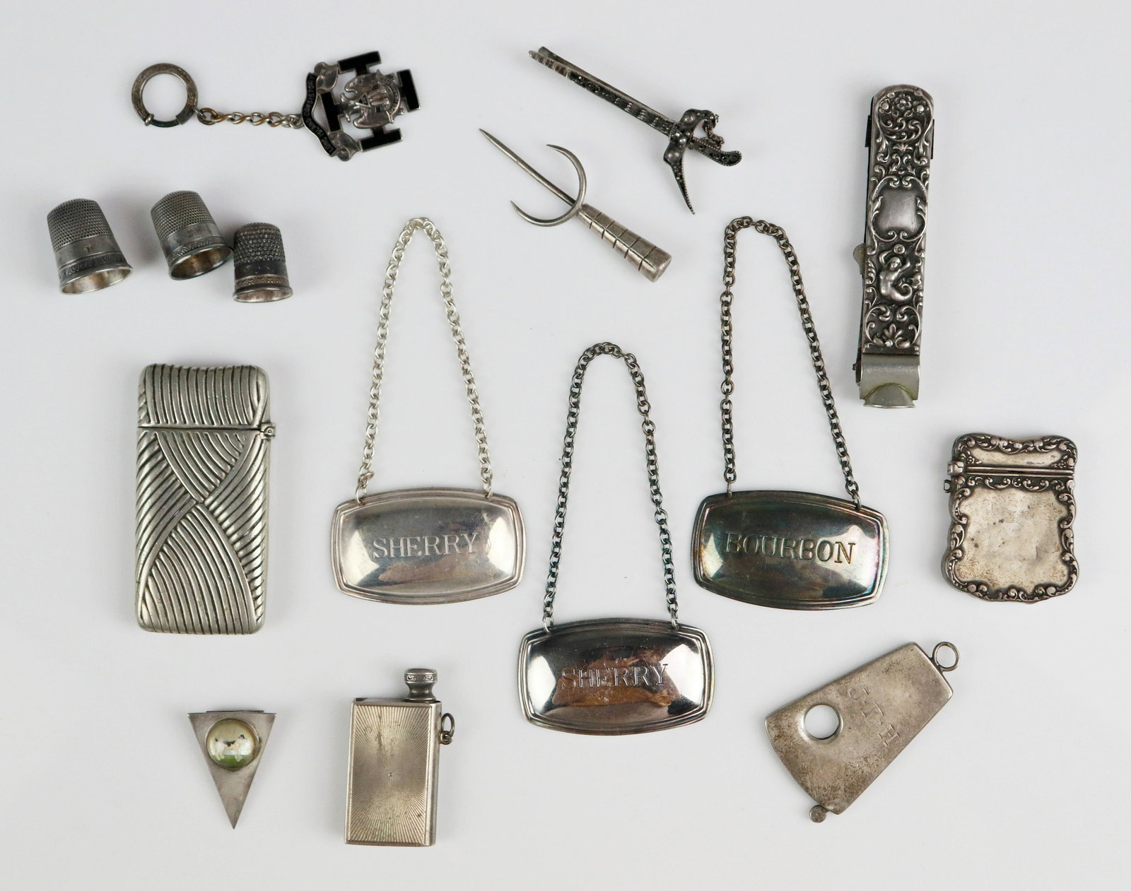 Sterling Silver and Silver Plated Items: Sterling Silver and Silver plated items C/O; (2) Sterling Silver cases, (1) Sterling Silver Cigar cutter, (1) Sterling silver book at pencil charm, (3) Silver thimbels, (1) silver pick, (1) Sterling S