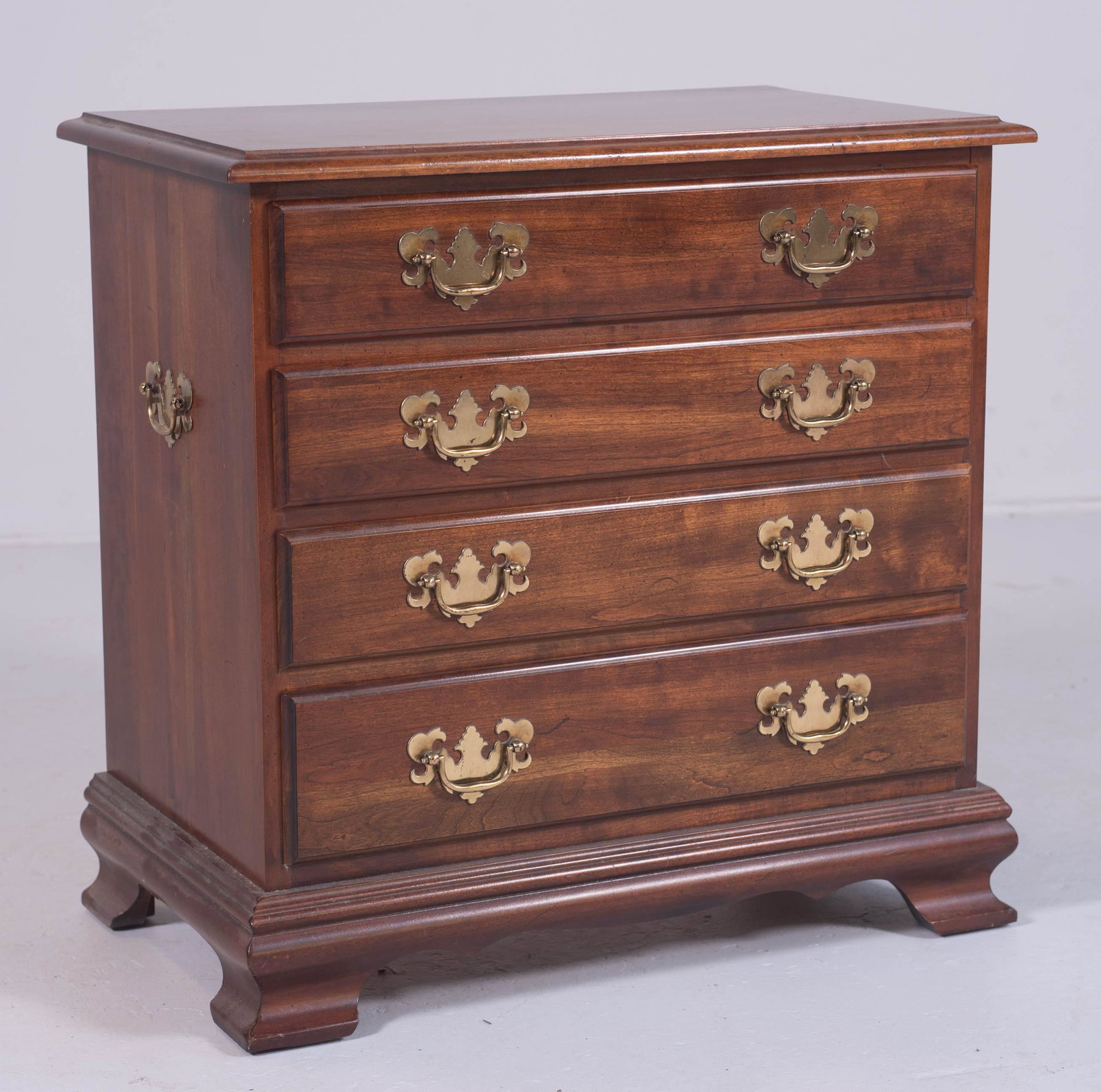 Georgian style walnut finished nightstand: Georgian style walnut finished nightstand, 4 drawers, 24" h x 26" w