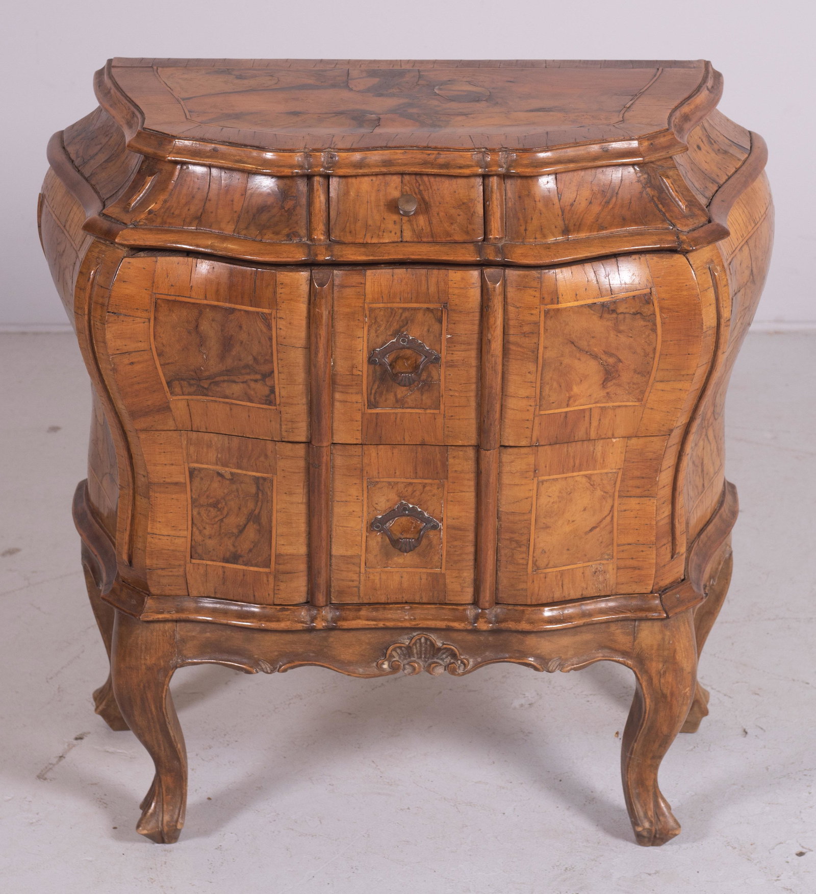 Walnut bombe commode: Walnut bombe commode, banded top with burl walnut, 27" h x 26" w, loose mouldings, loose veneer