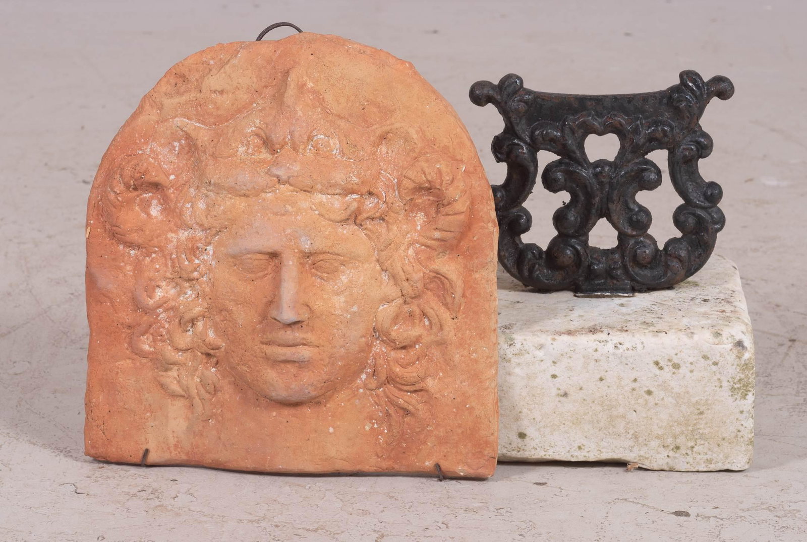 Terracotta figural hanging plaque, iron boot scraper: Terracotta figural hanging plaque, along with iron boot scraper, boot scraper 10" h x 9"square