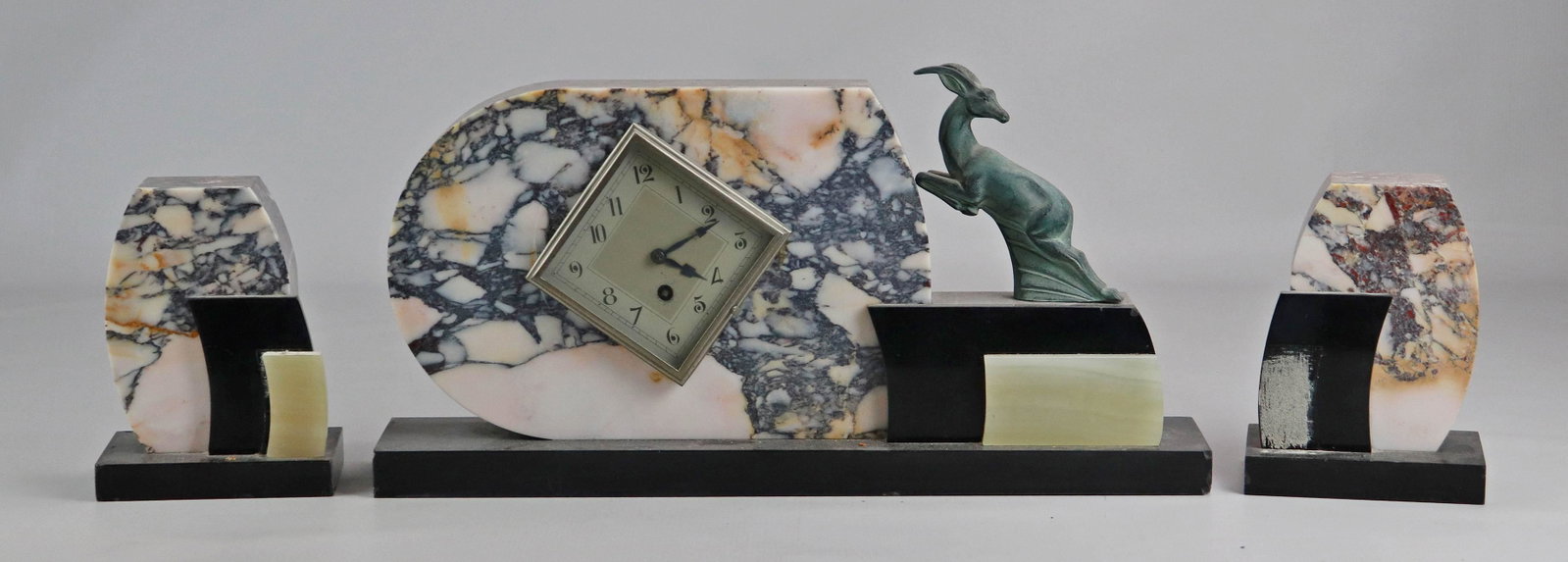 3 pc French Art Deco marble figural clock set, 9 1/2": 3 pc French Art Deco marble figural clock set, leaping gazelle to one side of clock, bookend garniture, 9 1/2" h, 18" wide