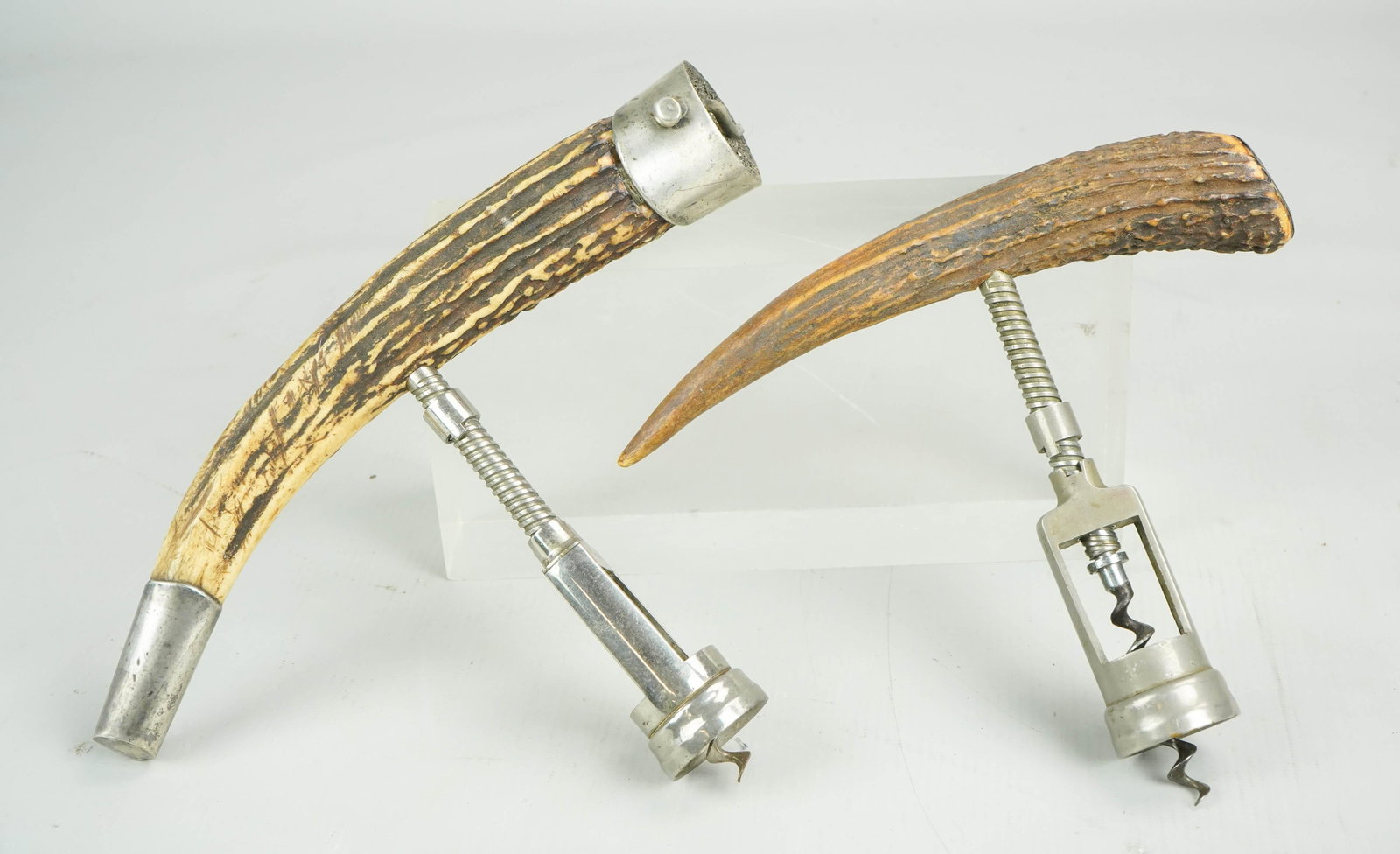 (2) Sterling Mounted Faux Horn Bottle Openers: (2) Sterling mounted faux horn bottle openers c/o stamped sterling opener, 10" and other stamped P.C.C 5-25-40 sterling, 7-1/2"
