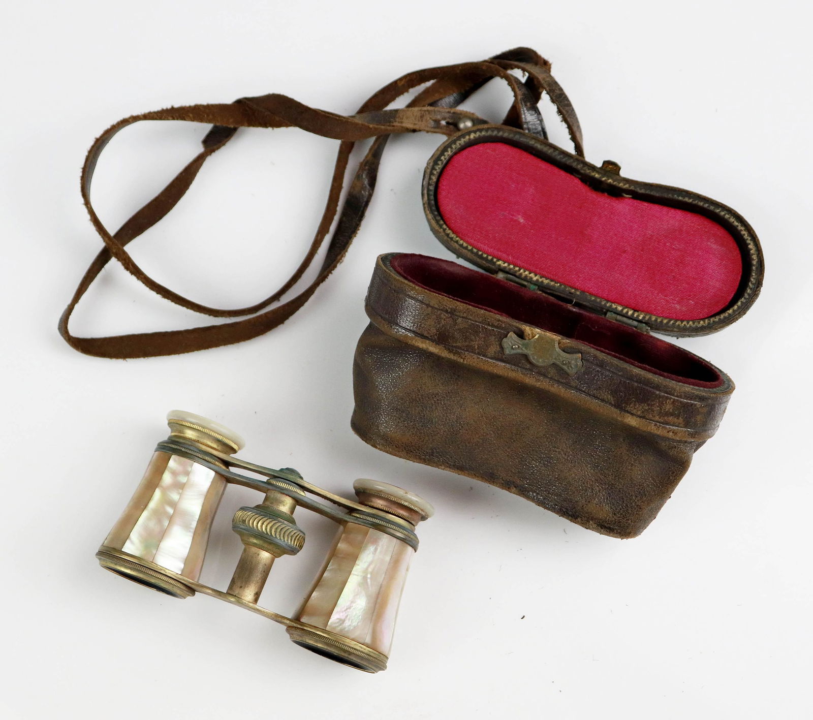 Parisian Mother of Pearl Opera Glasses: Parisian mother of pearl opera glasses, marked 'Latoua' or 'Latova' Paris at eye rim, (1) eye rim insert missing. Item includes leather fitted case, 3-1/2"x2-1/4"