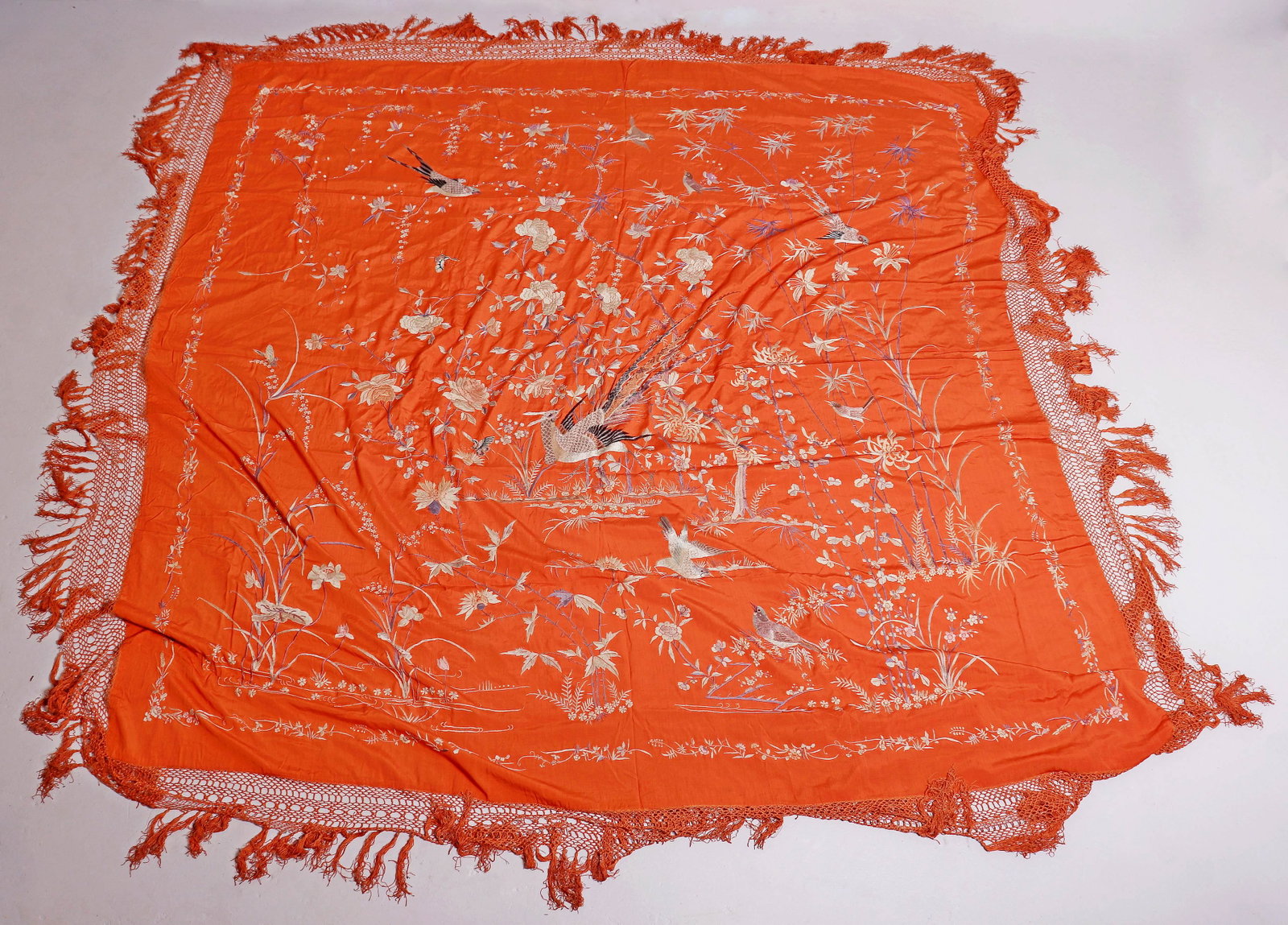 Monumental Embroidered Piano Shawl: Monumental embroidered piano shawl in rich reversible orange and blue silk. Orange side features impressive embroidered birds, flowers of several variety, foliage , cherry blossoms, chrysanthemums, ba
