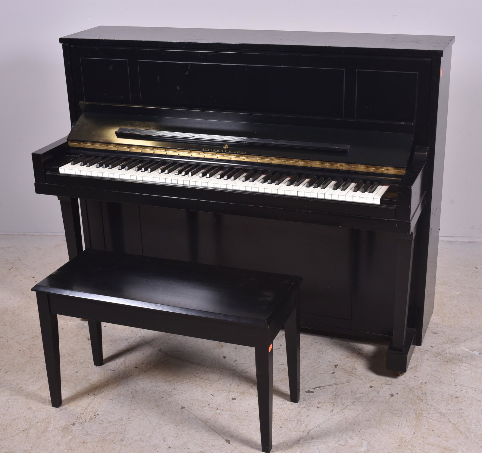 Steinway & Sons ebonized upright piano w/ bench: Steinway & Sons ebonized upright piano with bench, 477567 serial number, 52-1/2" h x 58" w x 13" d