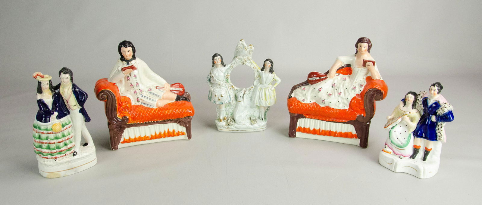 (5) Staffordshire Figures: (5) Staffordshire figurines, including 2 seated couples on chaises, watch holder, 2 double figurines, tallest 8-1/2", expected wear