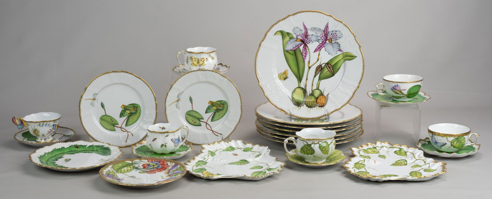 (25) Pcs Anna Weatherley Porcelain Dinnerware: (25) Pcs Anna Weatherley porcelain dinnerware c/o (7) botanical collection dinner plates with floral and butterfly decoration at center and gilt edge , 10-1/2" diam, (6) varied tea cups in floral, fol