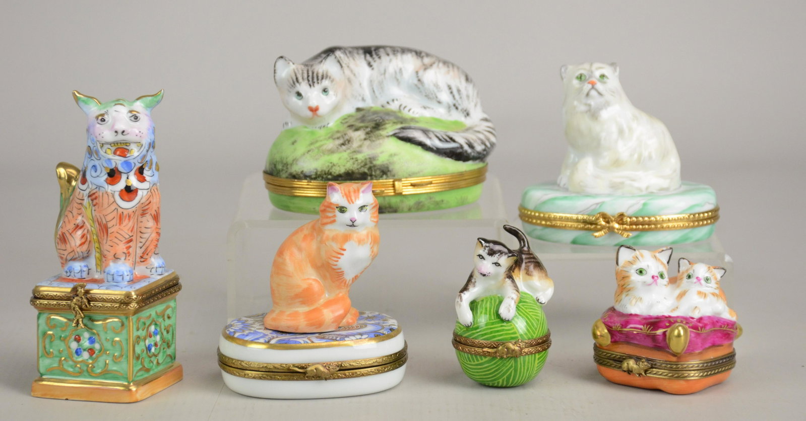 (6) Limoges Figural Cat Trinket Boxes: (6) Limoges figural cat trinket boxes c/o cat on yarn marked Limoges France Peint Main Rochard, 2-1/4", pr orange kittens on pillow marked Charmont Piet Main Limoges France Exclusive, 2" h, striped ca