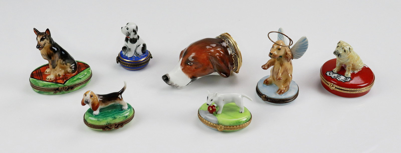 (7) Limoges Figural Dog Trinket Boxes: (7) Limoges figural dog trinket boxes c/o Bull Terrier with ball, marked Limoges France Peint Main, 2-1/2", Shar Pei on red pillow, reading 'beauty is only skin deep!' on inside, underside reads Artor