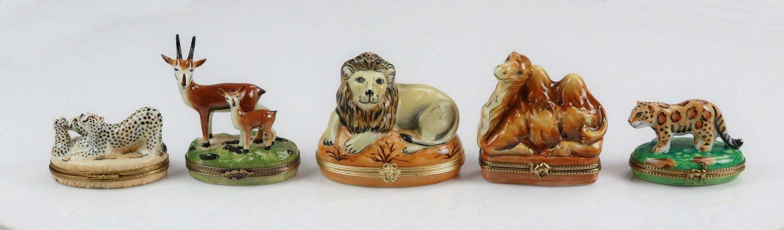 (5) Limoges Exotic Animal Trinket Boxes: (5) Limoges exotic animal trinket boxes c/o joined antelope figure topped box marked Peint Main Eximious Limoges France, 2-3/4", joined leopard figure topped box marked Cardinet France Peint Main Limo