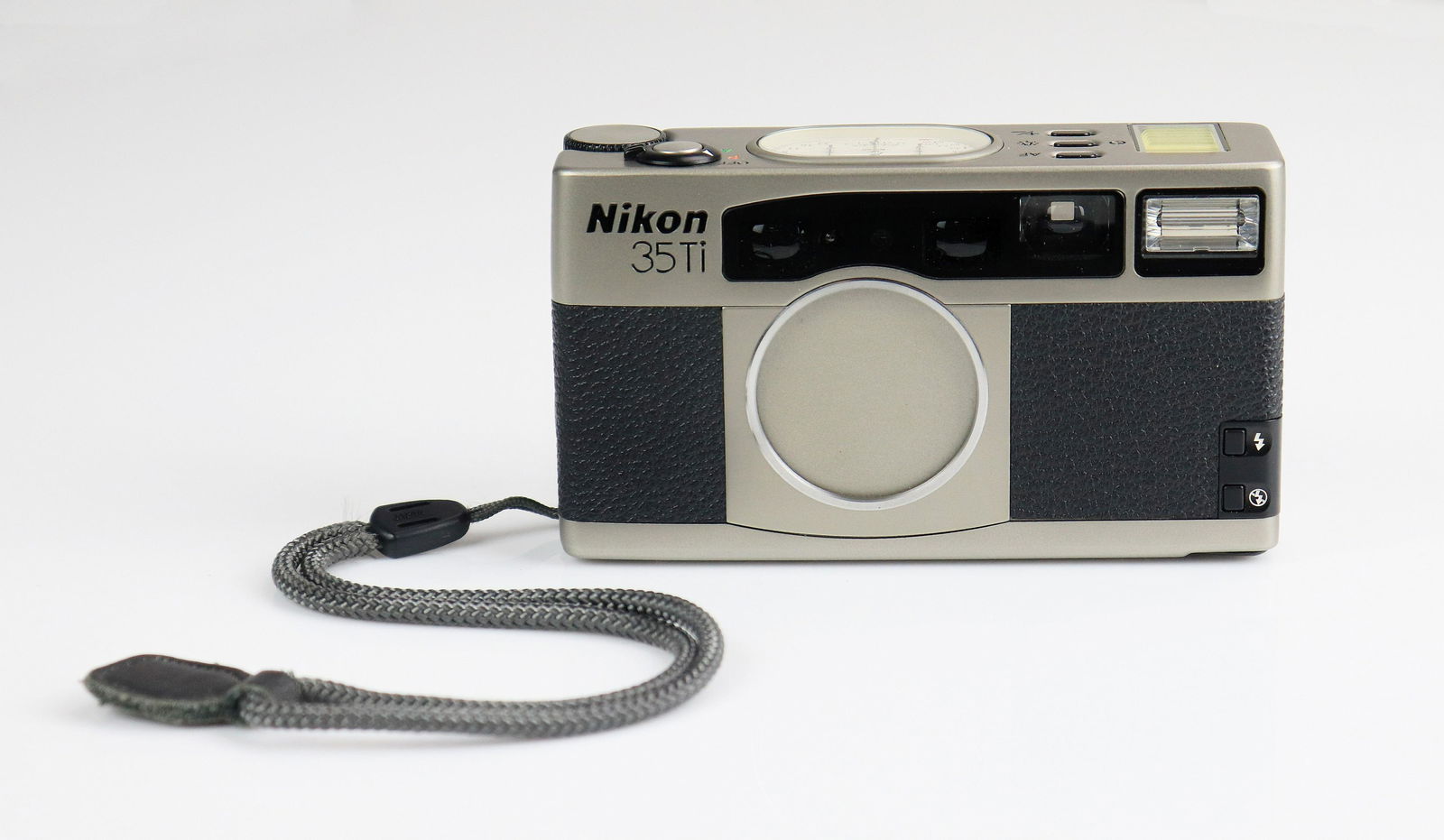 Nikon 35ti 35mm Point and Shoot: Nikon 35ti 35mm point and shoot camera with leather case. Battery tested, zoom, shutter and flash all function as expected LCD display in good condition as are needles on top of camera.