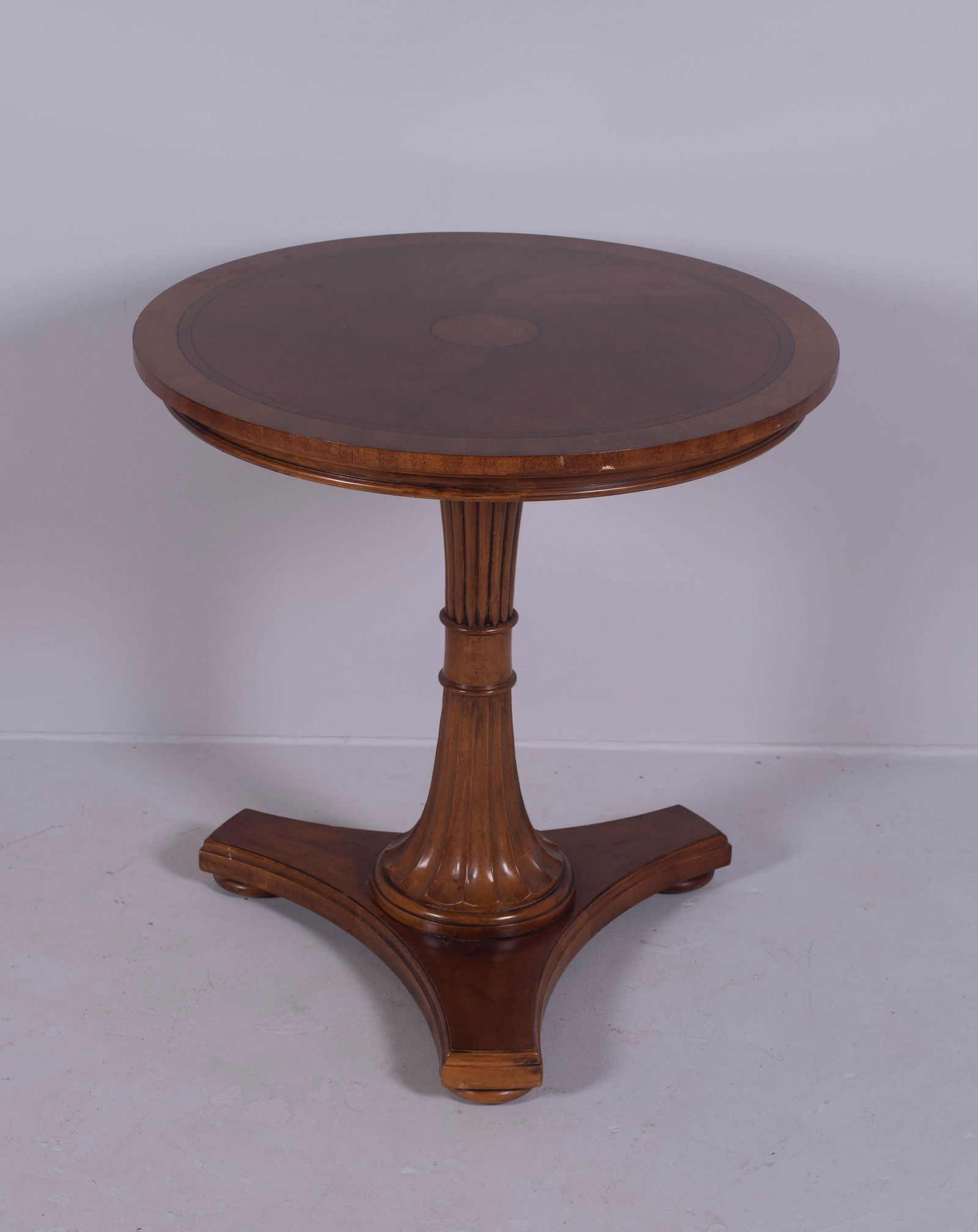 Ethan Allen mahogany inlaid lamp table: Ethan Allen mahogany inlaid lamp table, 28-1/2" h x 28" diameter, small damages at edge