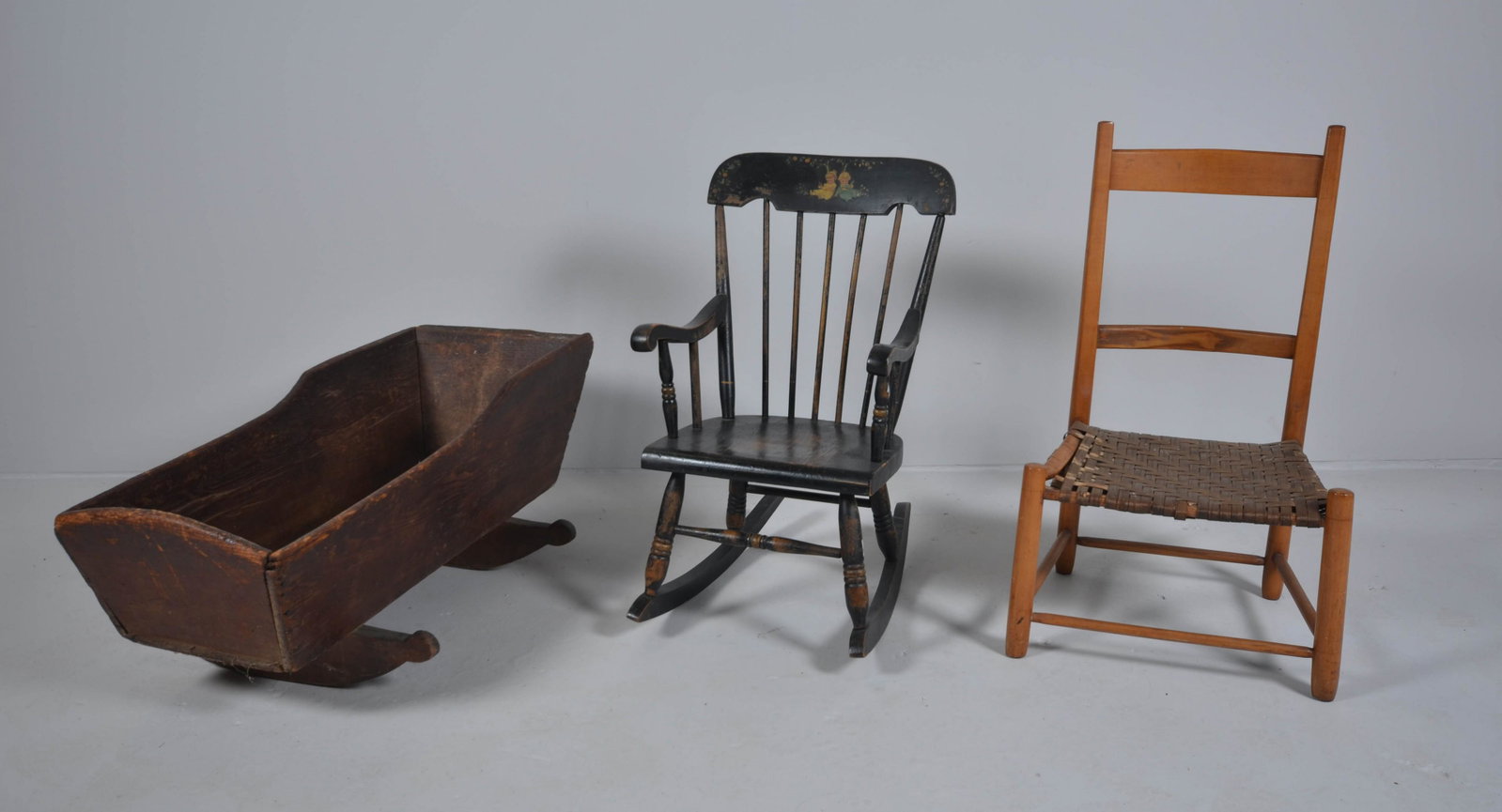 Child's paint decorated rocker: Child's paint decorated rocker, wear to paint, child's woven seat side chair, damaged and worn seat, rocking cradle, overall wear largest 31" h, seat height 10-1/2" h