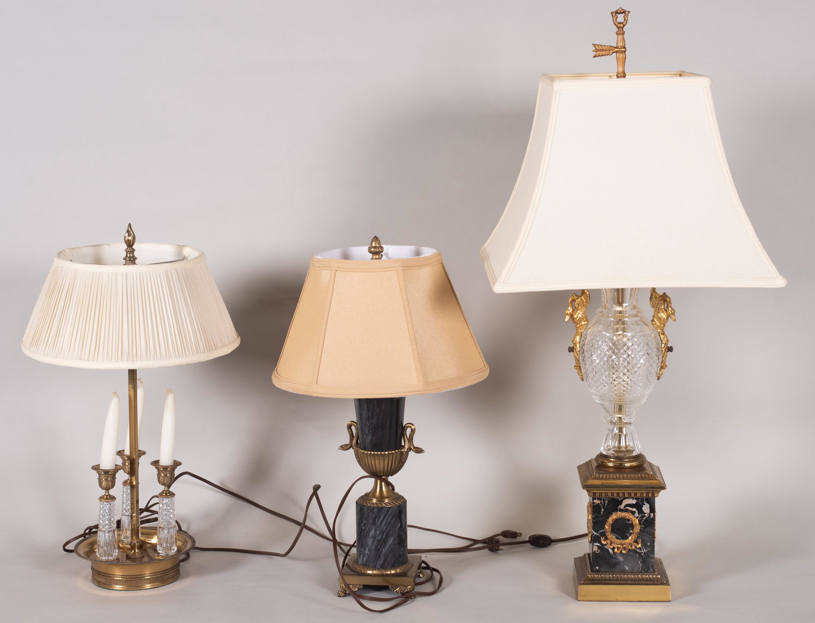 (3) Crystal and Marble Table Lamps: (3) Crystal and marble table lamps to include French style marble based lamp with gilt swan mounted crystal center, 33" h, marble urn form lamp raised on brass foot mounted with swan neck handles and 