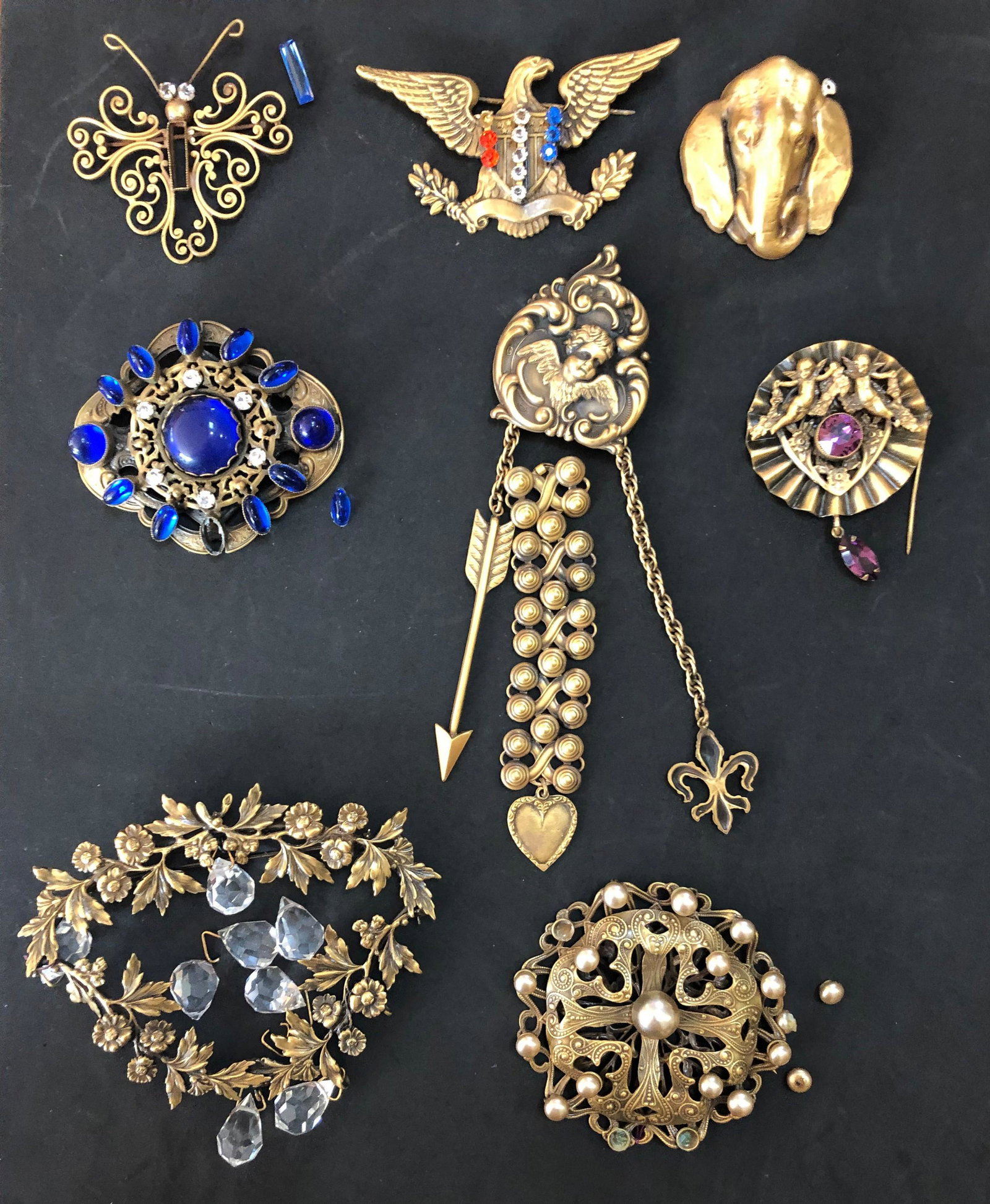 (8) Joseff Hollywood Pins/Brooches: (8) Joseff Hollywood Pins/Brooches, each in need of some repair, stones need resetting but present, 3 pearls fell out but present; clasp does not close. Pin with purple stone - pin broken off. Elephan