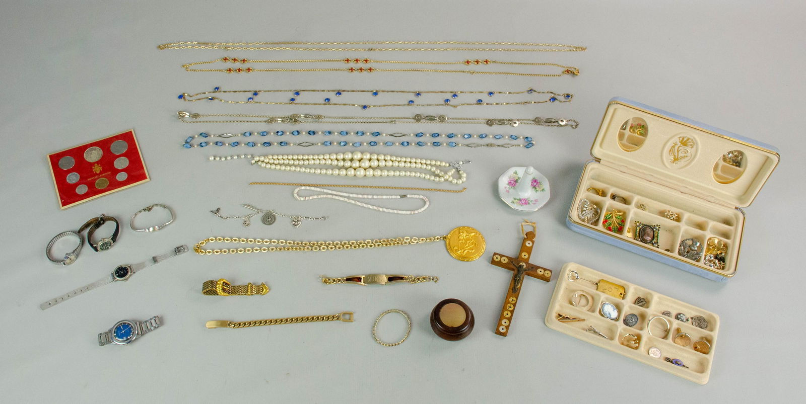 Costume Jewelry and Dresser Item Lot: 52 Pc Costume Jewelry Lot C/O; (1) Blue compact jewelry box, (1) small wood trinket box, (1) crucifix (6) fashion chains gold and silver tone, (4) ladies watches, Wittnauer, timex, croton and eurotech