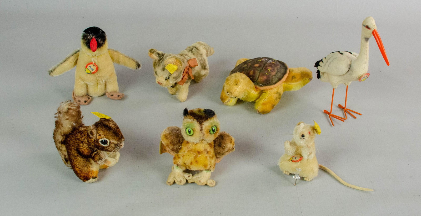 (7) Steiff and Style Miniatures: (7) Steiff and style miniatures to include Wittie the owl- missing tag and beak 4", Adebar 6-1/2", Peggy 5", mohair turtle made in Japan, Tabby with button ear, Perri with button ear and red eye Pieps