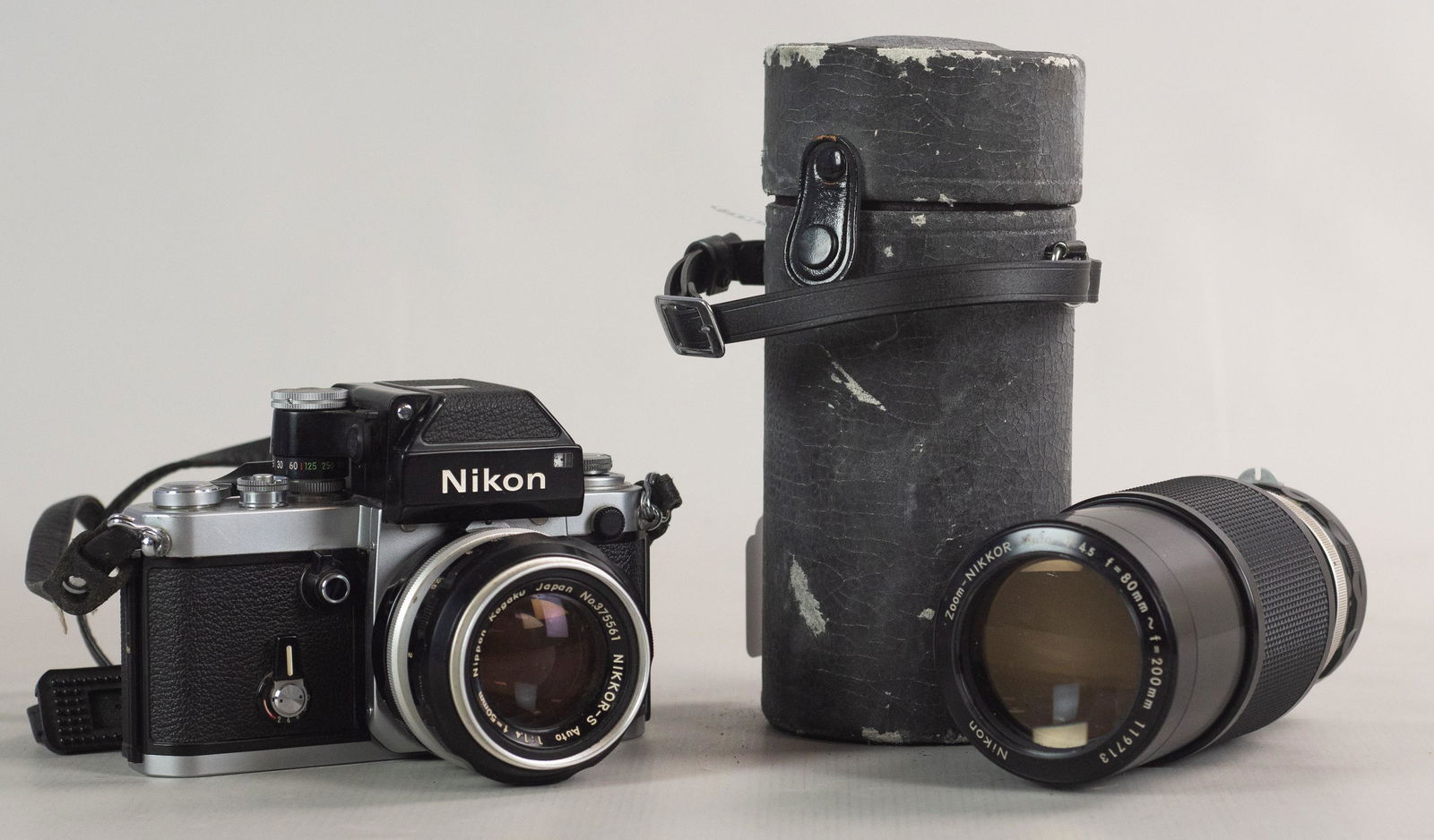 Nikon F2 Photomic 35mm SLR with lenses: Nikon F2 Photomic, 35mm SLR camera with Nikkor 50mm 1:1.4 non-Ai and Zoom Nikkor 80-200mm 1:4.5. In very good cosmetic condition, shutter fires at low speeds accurately, meter not tested though no cor