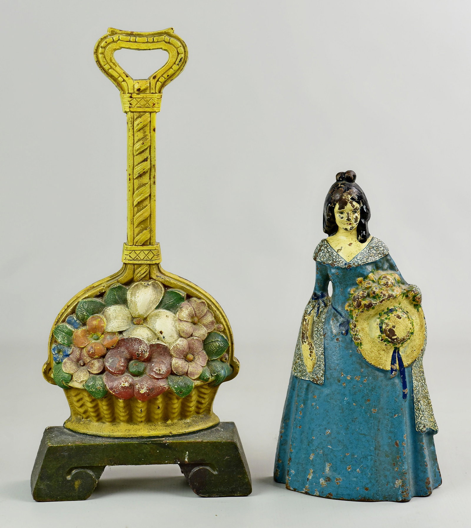 Flower Basket and Southern Bell Door Stop: Flower Basket and Southern Bell cast iron door stops c/o flower basket form door stop on raised deco style base with loop top handle, 16-1/4" h, unmarked and National Foundry style southern bell door 