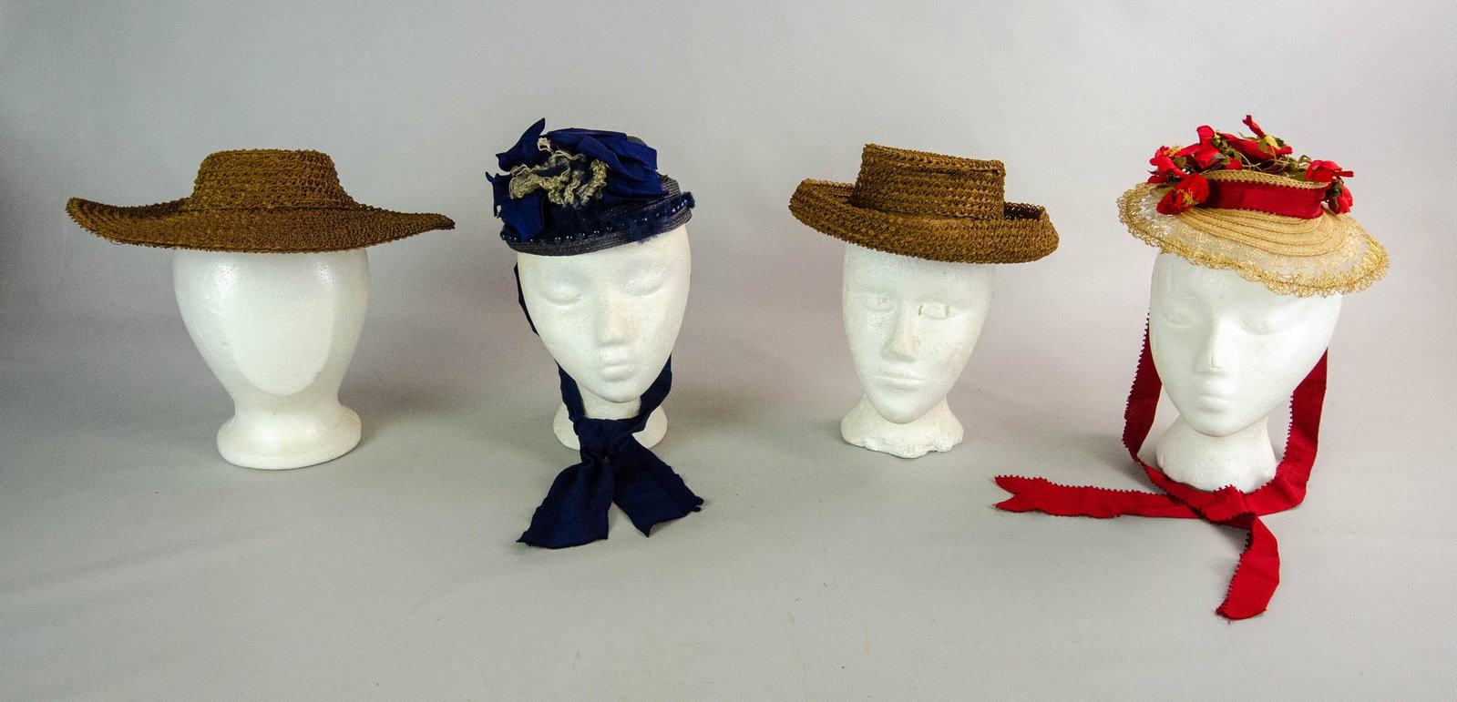 (4) 19th c. Hats: (4) 19th c. hats to include (2) straw bergeres, 2" crown on each, straw bonnet with silk flower adornment and tie and blued bonnett with glass bead surround and silk adornment.