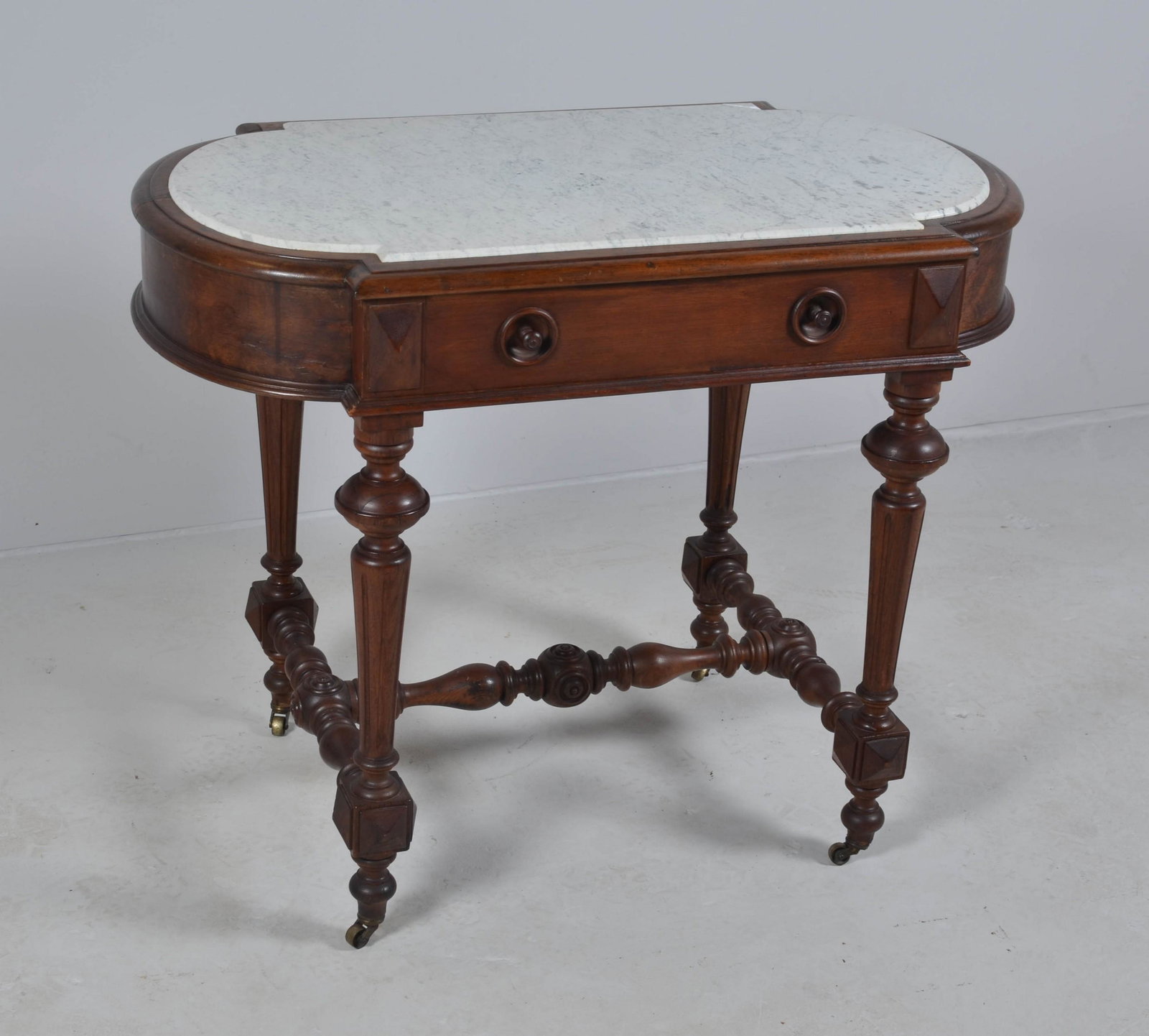 Victorian walnut carved marbletop center table: Victorian walnut carved marbletop center table, single drawer, marble inset, 30-1/4" h x 38" w