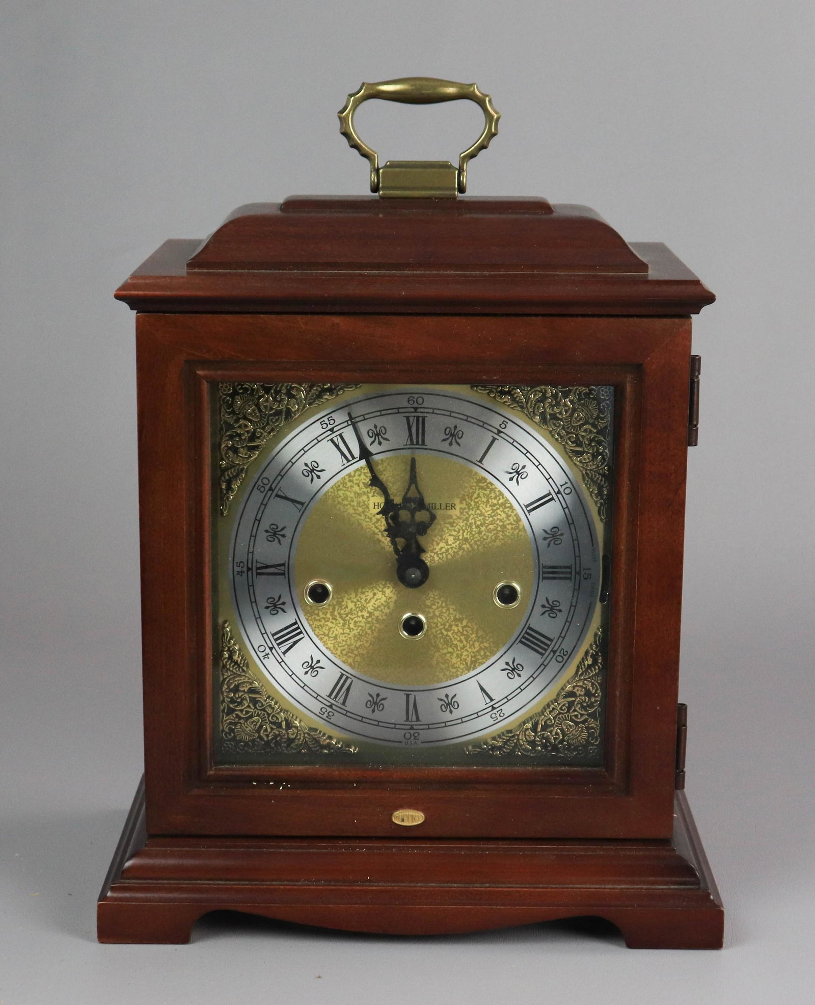 Howard Miller Chime Shelf Clock: Howard Miller chime shelf clock, DuPont medallion on front, AEL01, serial number 7107860337, instruction manual & key included, 12-1/4" h (excluding handle) x 10-1/2" w