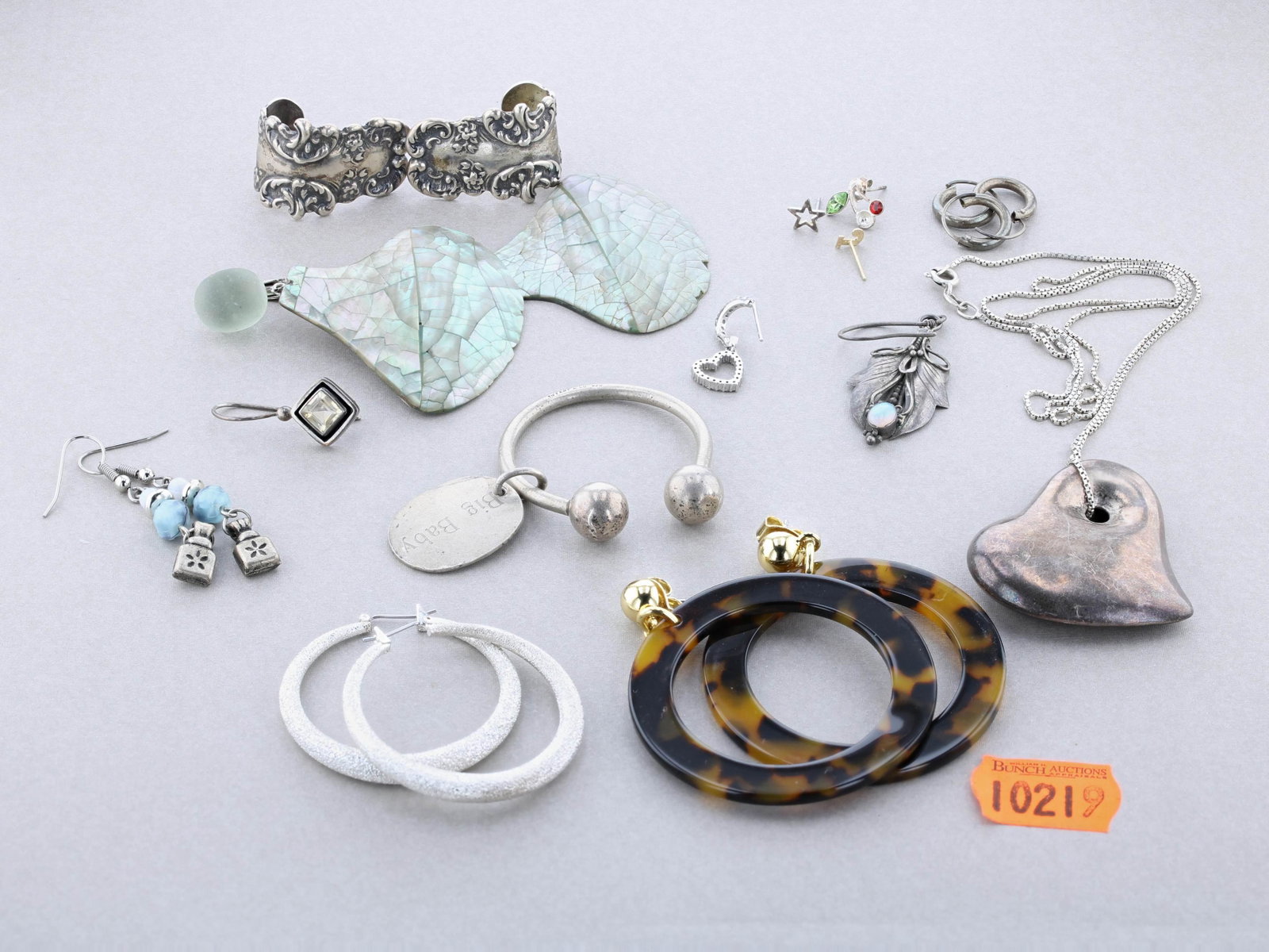 Tiffany Key chain and other Silver Jewelry: Tiffany Key Chain and other Silver Jewelry Lot C/O; (1) T&CO key ring with an engraved tag "Big Baby" "Annie 6-26-91", (3) Pairs of modern Fashion Earrings, (1) pair of sea glass and seashell earrings