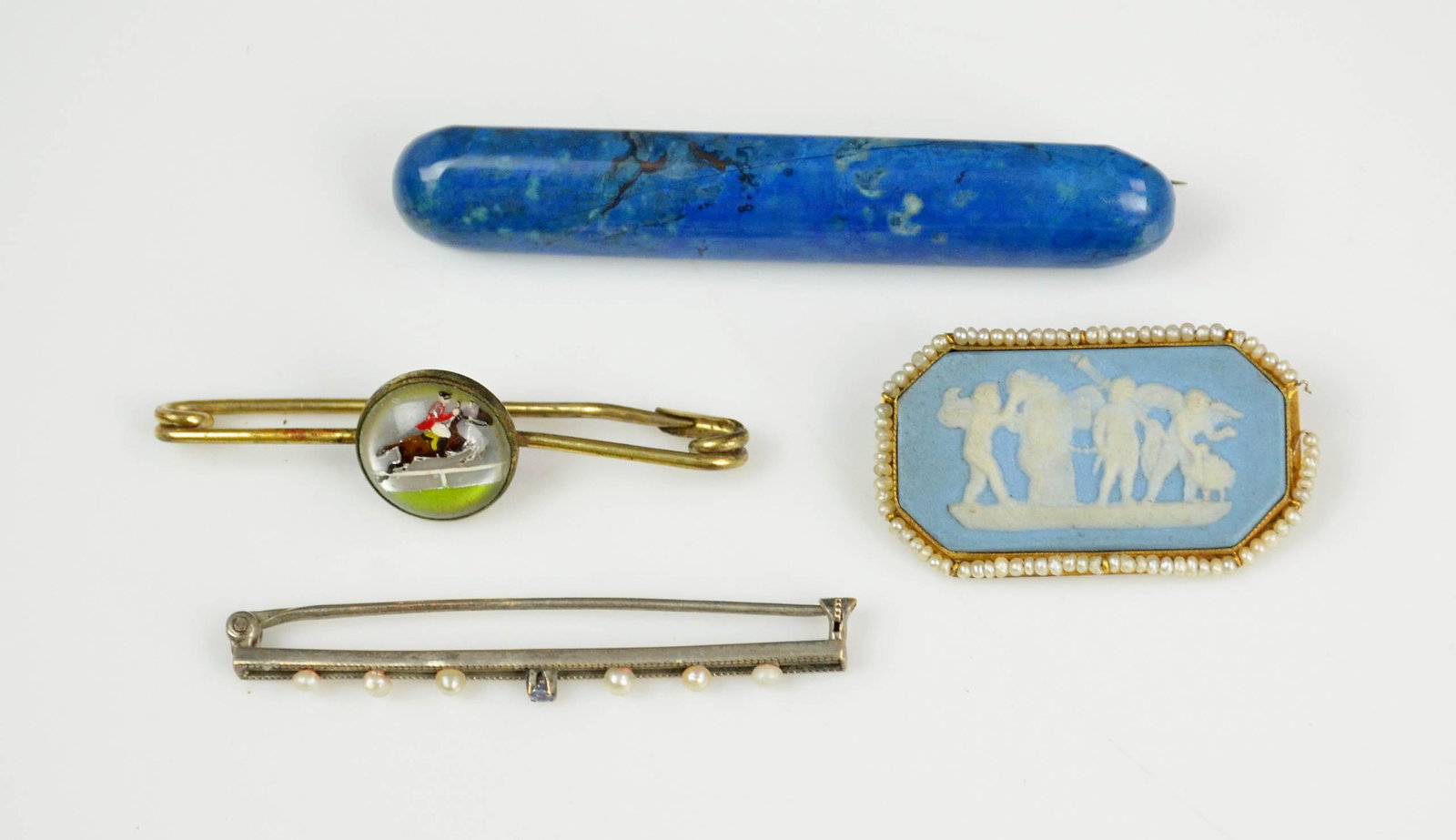 Gold Bar pins and Brooches: 4Pc Gold bar Pins and Brooches, C/O; (1) Blue stone C clasp bar pin, (1) 10K white gold and pearl bar pin 1.6 Dwt (1) Wedgewood brooch, with a 10K seed pearl gold frame, in need of repair, (1) Gold to