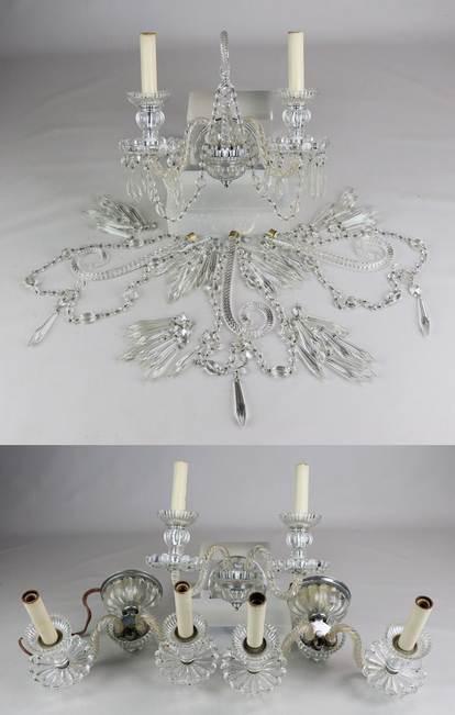 (4) 2-Arm Crystal Sconces: (4) 2-Arm crystal sconces c/o circular floral backplate issuing two scrolling arms terminating to a bobeche with crystal drops, flanking a scrolling plume suspending crystal swags and drops, 13" L, 13