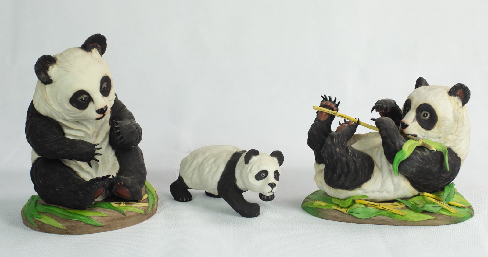 (3) Boehm Pandas: (3) Boehm pandas to include panda cub, 6-1/2", seated panda cub, 9" h and reclined giant panda cub, 8"