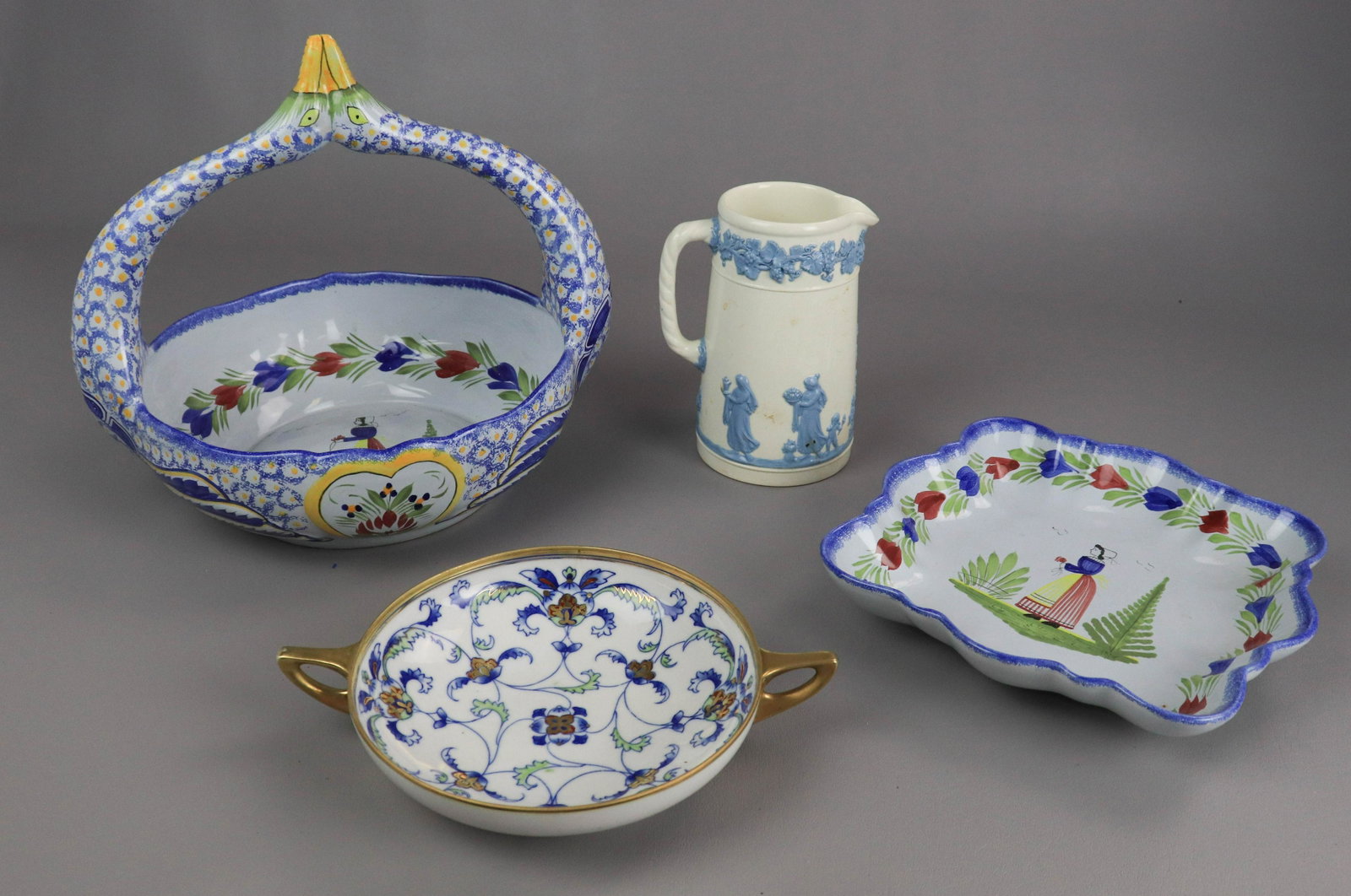 (4) Pcs Porcelain & Pottery: (4) Pcs porcelain & pottery, c/o Quimper 9-1/2" square bowl, Quimper basket with double gooseneck handle (10-1/4" x 13" x 11" h), Wedgwood blue on white embossed Queensware pitcher (6-3/4" h), Nippon 