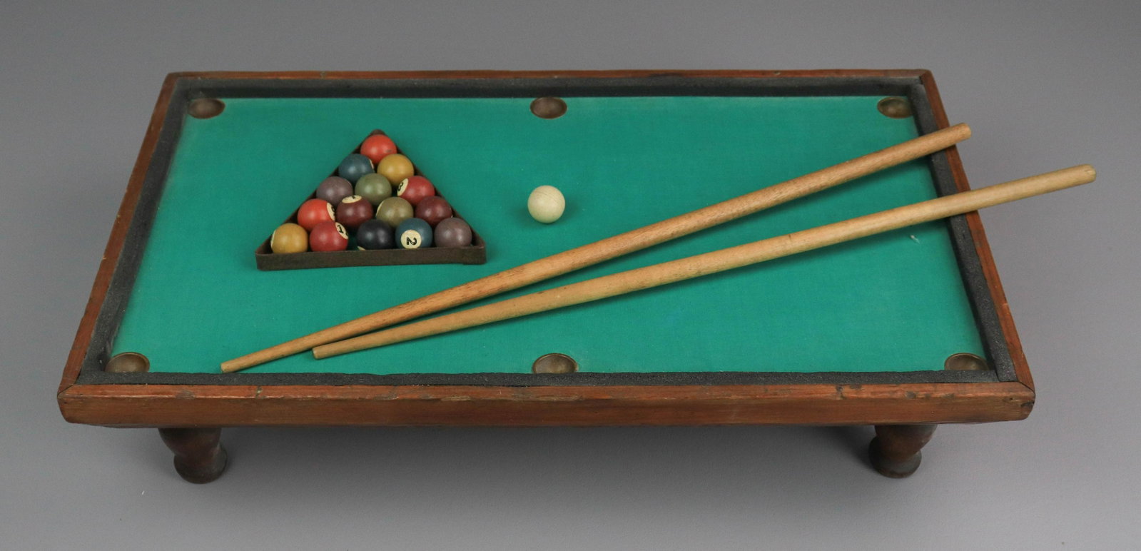 Liliputian Billiard or Pool Table: Lilipution Billiard or Pool table, manufactured by OV Smith New Haven CT, copyright 1902, turned legs, 21-1/4" x 12-3/8" x 5" h, with 16 balls, triangle rack, (2) 20" long sticks
