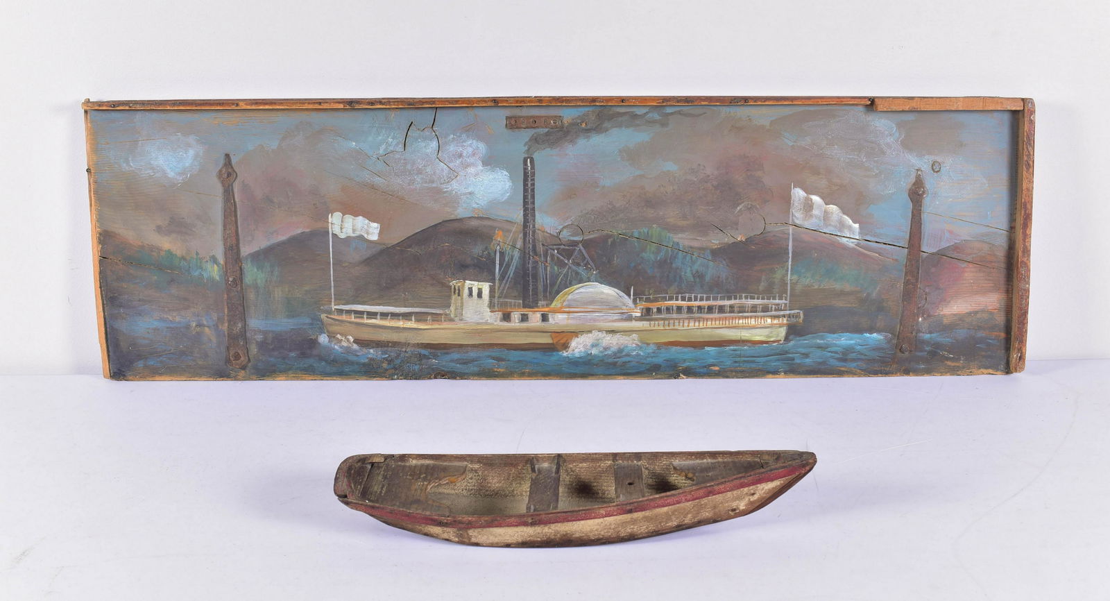 Folk Art Model Boat and Painting: Folk art model boat and painting to include model row boat with old red paint, 19" and chest cover with painted paddle wheel steamer scene at center, unsigned, affixed for hanging, 3ft11"x1ft2-1/2"