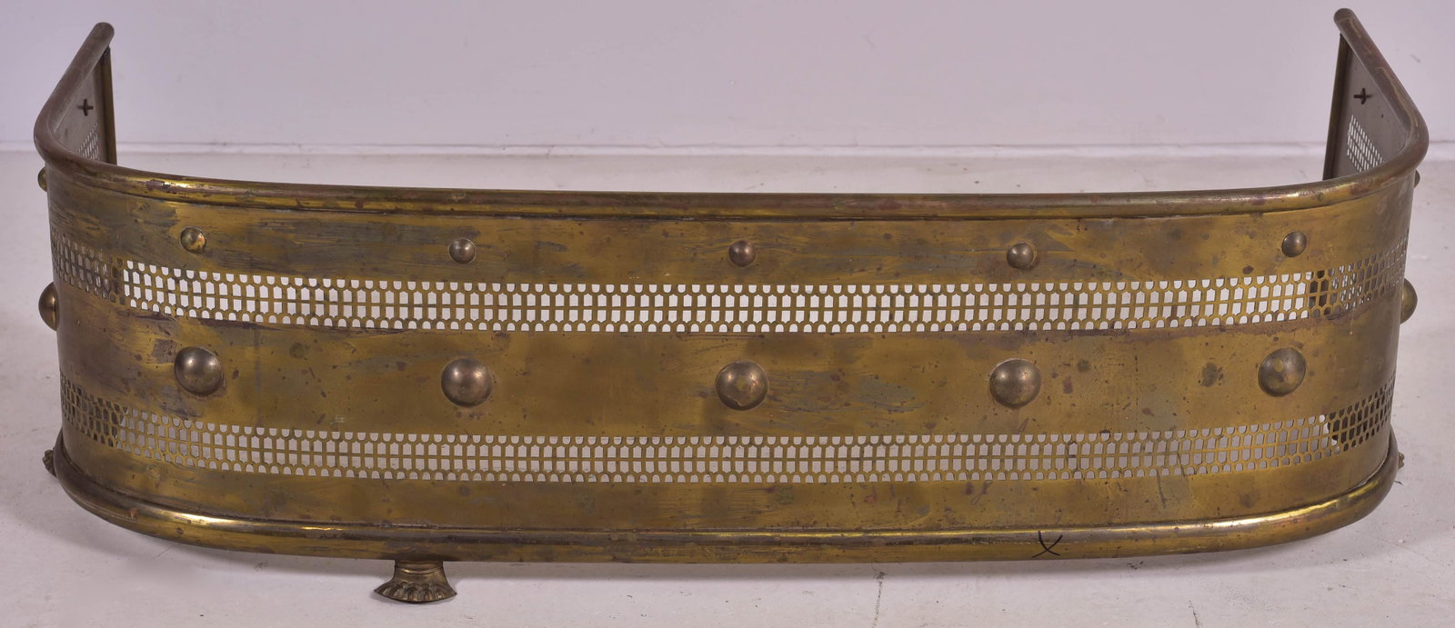 Georgian Style Fire Fender: Georgian style fire fender in brass with pierced decoration, convex applied buttons and paw feet, 45"L, 20"D, 14"H