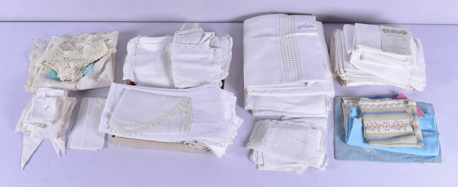 Linen and Lace Table Coverings: Linen and lace table coverings to include pure linen table coverings with openwork, fine linen hand towels, some with sifer, assorted lace and embroidered placemats, openwork and embroidered tea table