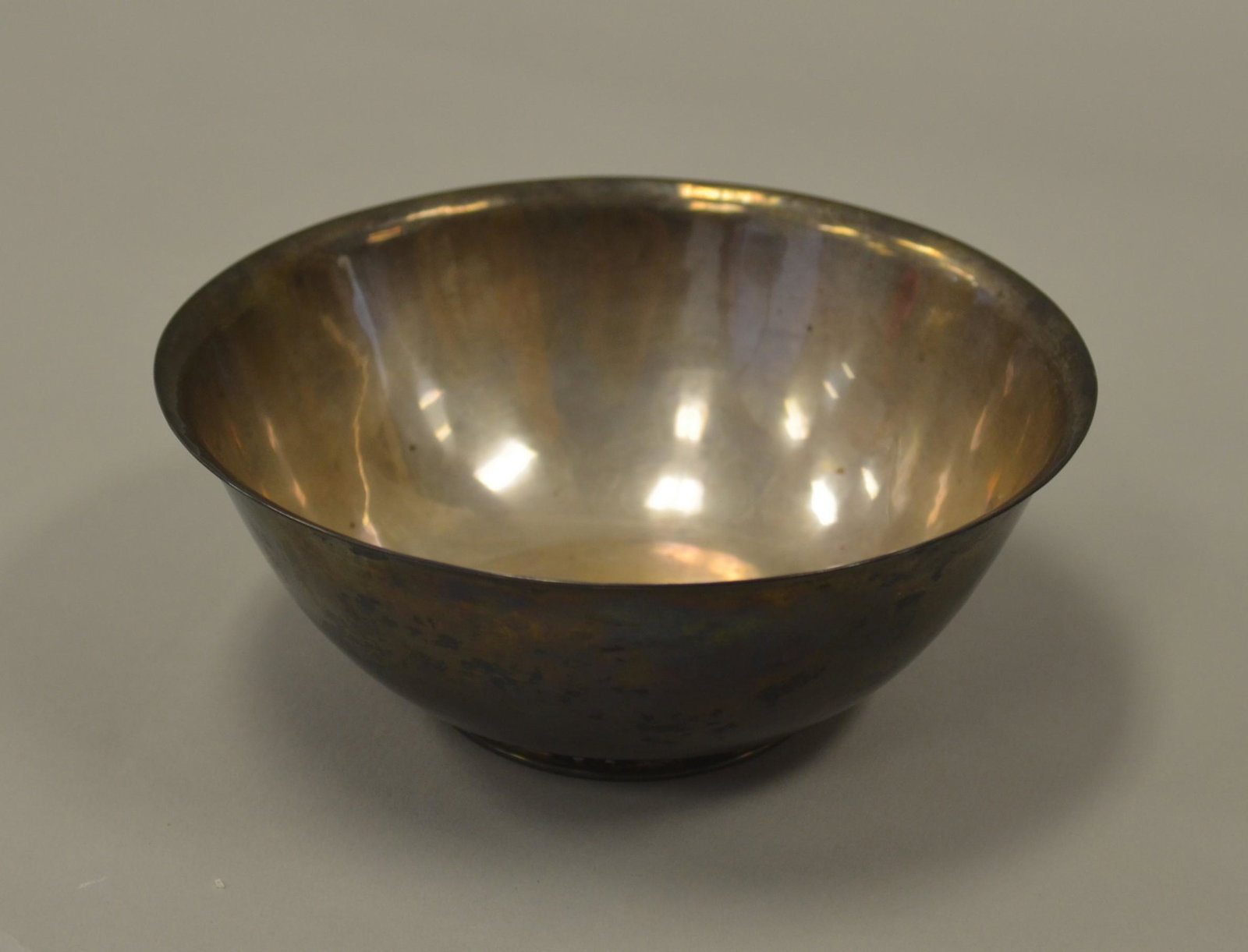 Frederick J. Gyllenberg Sterling Bowl: Frederick J. Gyllenberg sterling bowl, footed with monogram at center, 7" diam x 2-3/4" h, marked at underside. 11.1 T.O