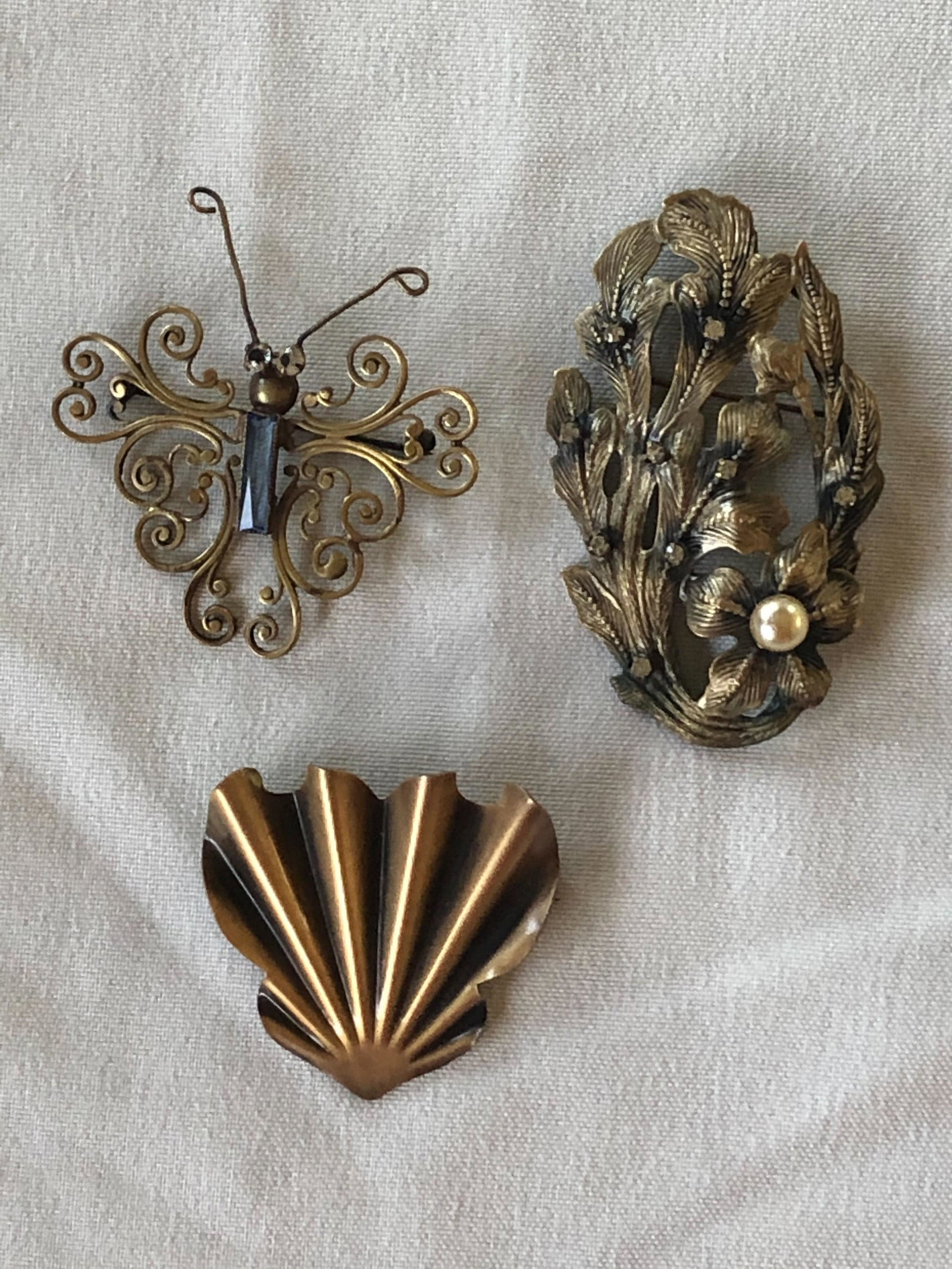 Joseff of Hollywood (3) pins, butterfly w/stone: Joseff of Hollywood (3) pins, butterfly w/stone , 2 1/4", floral spray w/faux pearl & rhinestones, 3 "h, fan, 2"