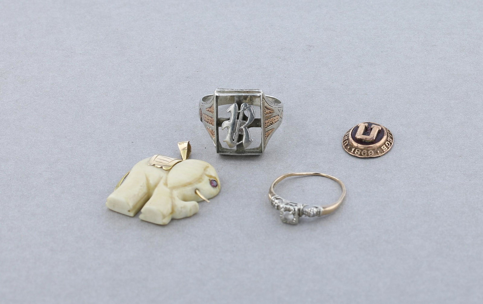 Gold Jewelry Lot: Ã¯Â¿½Gold Jewelry scrap Lot C/O: (1) ladies ring marked 14K, with clear stones (1) mens ring marked 14K, white and rose gold broken, (1) carved elephant with gold accents marked 14K, (1) Cl